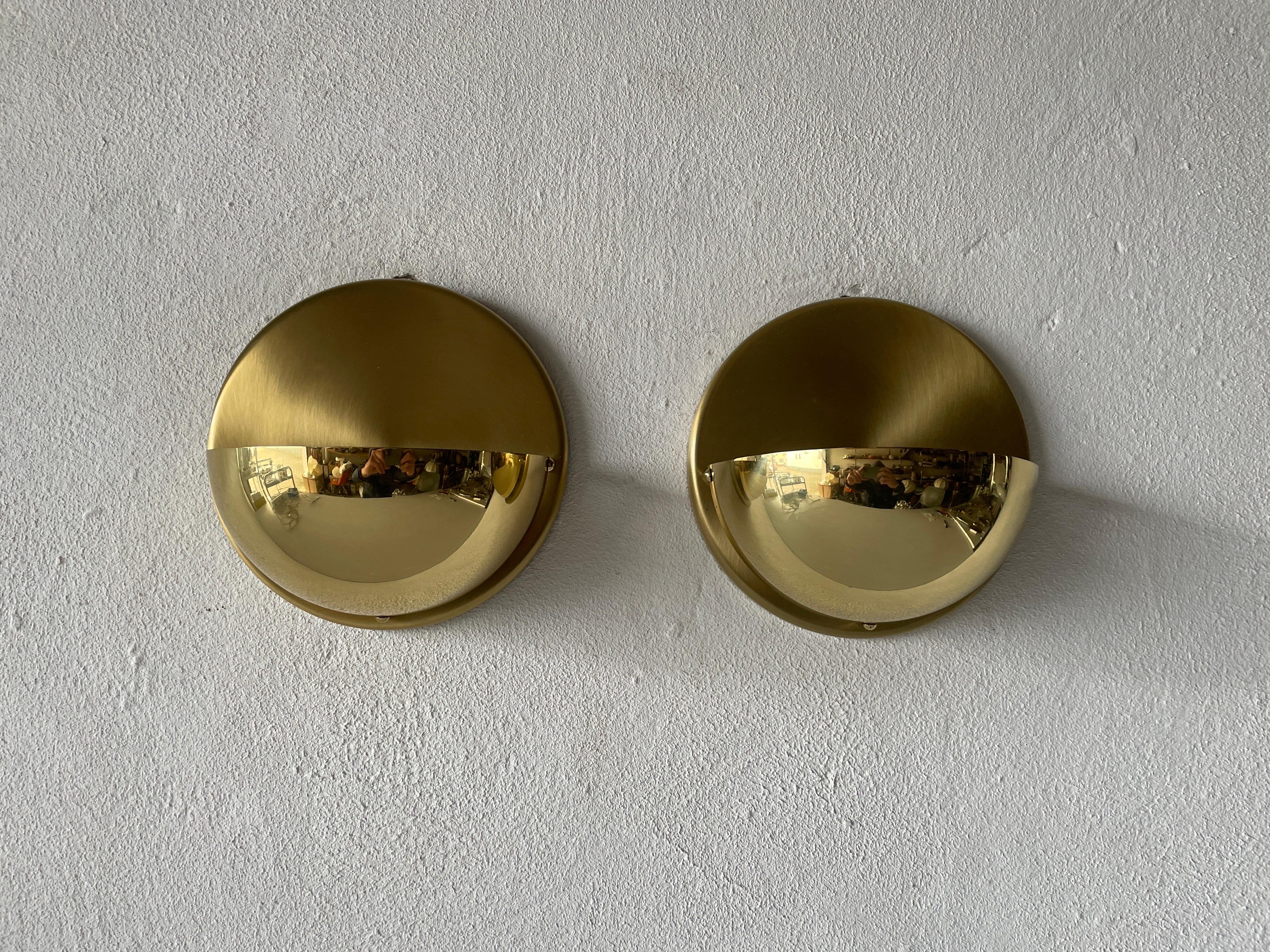 Brass pair of Sconces by Bankamp Leuchten, Arnsberg 1, 1970s, Germany.

Very elegant and Minimalist wall lamps

Lamps are in very good condition.

These lamps works with E27 standard light bulbs. 
Wired and suitable to use in all countries.