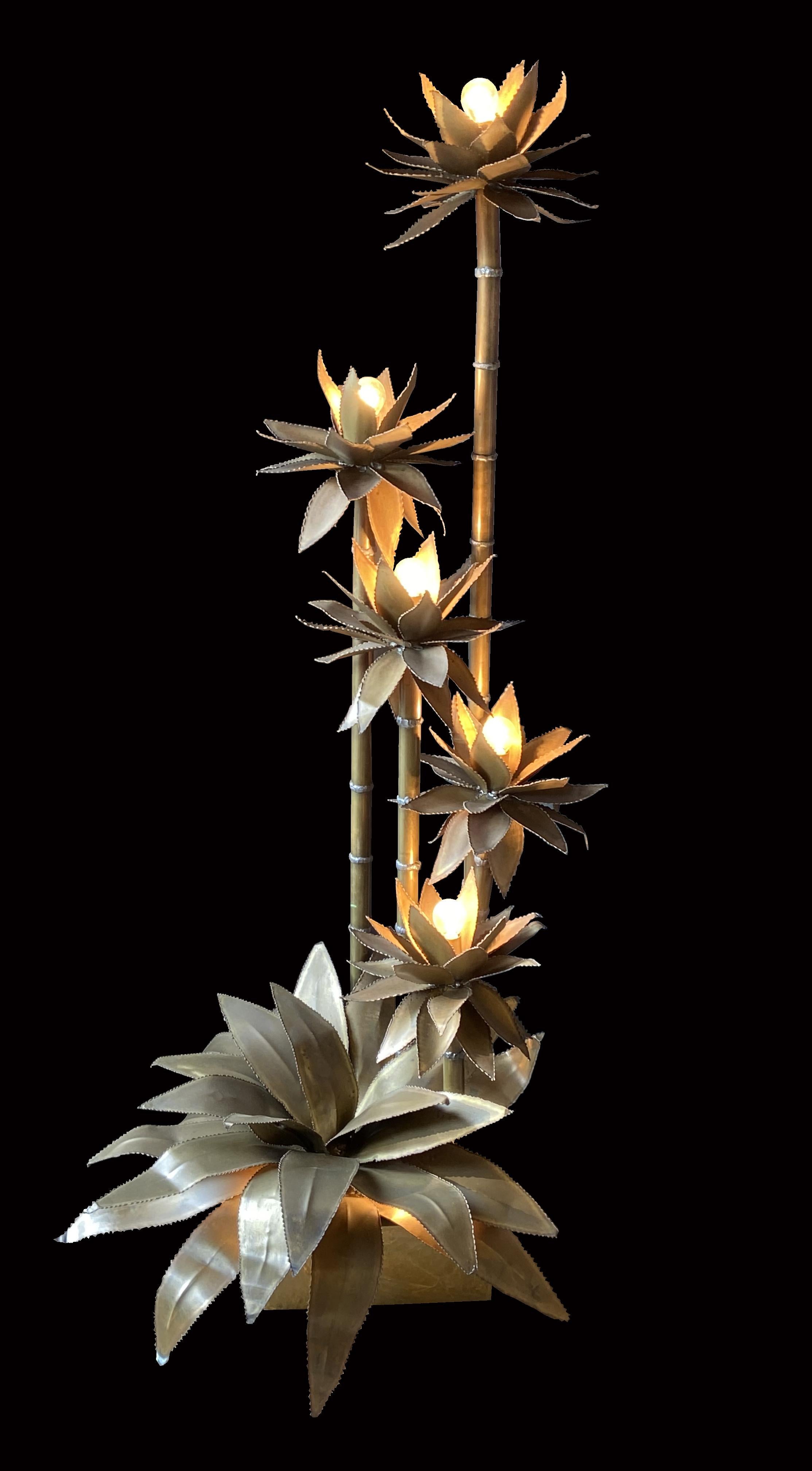 This stunning floor lamp is made from brass tubing for the bamboo type stems and brass sheet for the leaves, very much in the style of Maison Jensen.
It has a total of 7-light bulbs giving a wonderful effect when illuminated with the many and