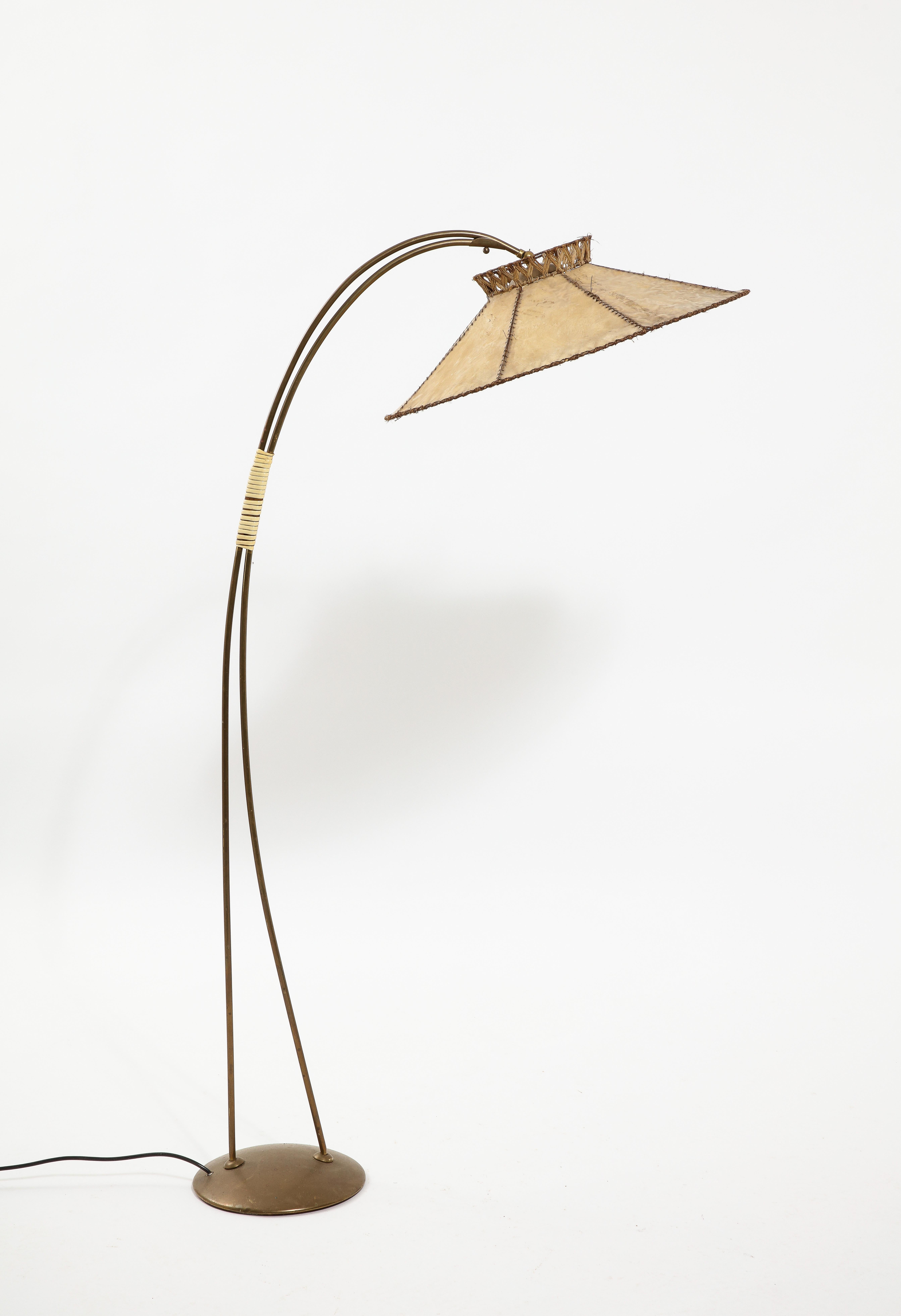 Brass reading floor lamp with its original hand stitched parchment shade.