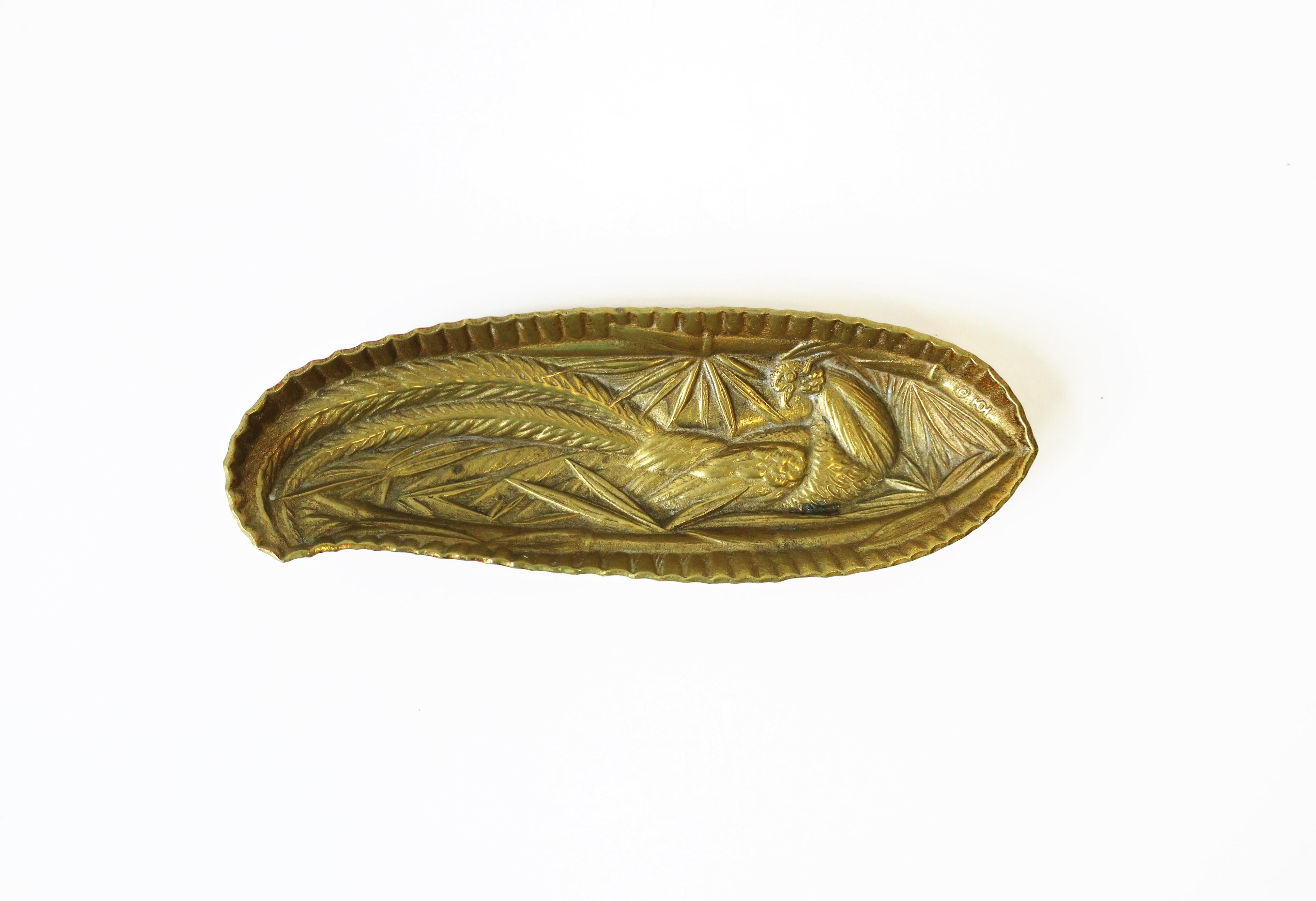 A beautiful and substantial solid brass oblong vide-poche dish embossed with pheasant peacock bird designed by Scandinavian Norwegian Sculptor Oscar J. W. Hansen, circa 1948. With maker's mark on bottom as show in image #12. 

Measures: 3
