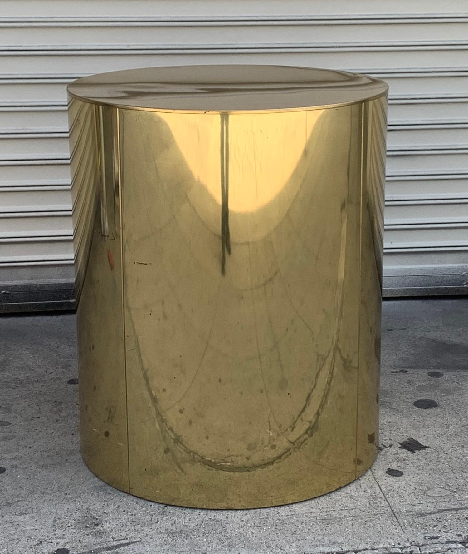 Vintage brass pedestal/drum table by Curtis Jere, the pedestal can be used as a base for a dining table or a base for a large sculpture.
The piece is in vintage condition with some rusted spots and nicks and mild scratches.
Measurements: 23.5