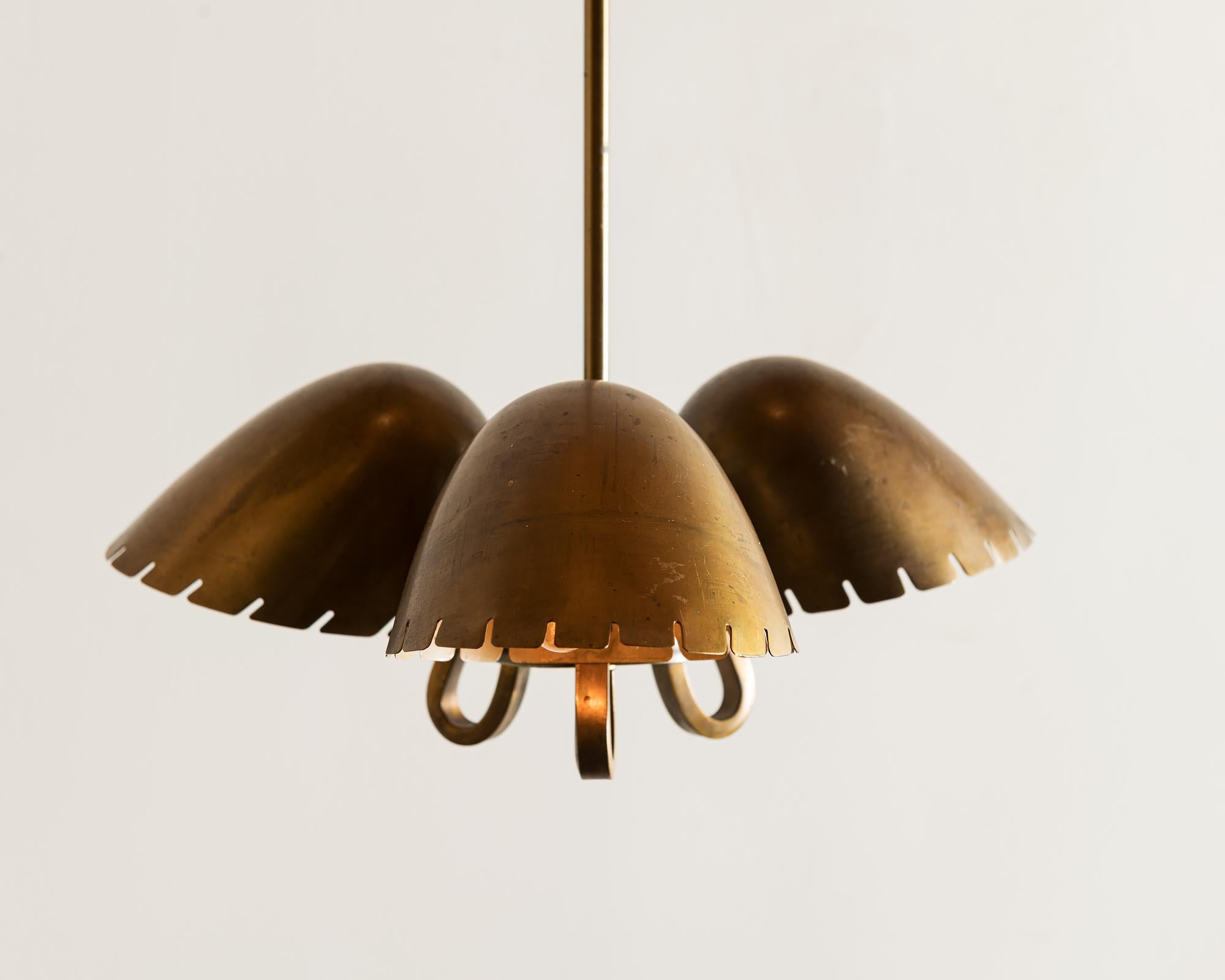 A rare brass pendant by Carl-Axel Acking, 1940s.

Listed dimensions are for the fixture without the drop. The drop is a fixed brass rod that runs 50