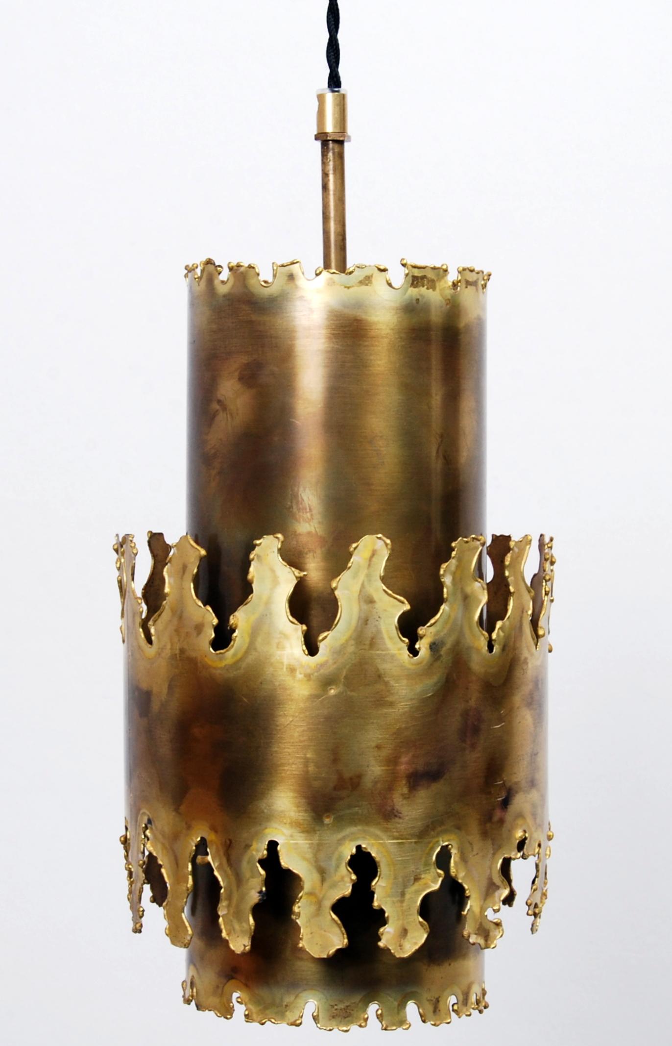 Handmade Brutalist brass pendant made of acid treated and flame cut brass in three layers designed by Svend Aage Holm Sørensen for his own company Holm Sørensen & Co. It was manufactured in Denmark in the 1960s. Original cord replaced with a black
