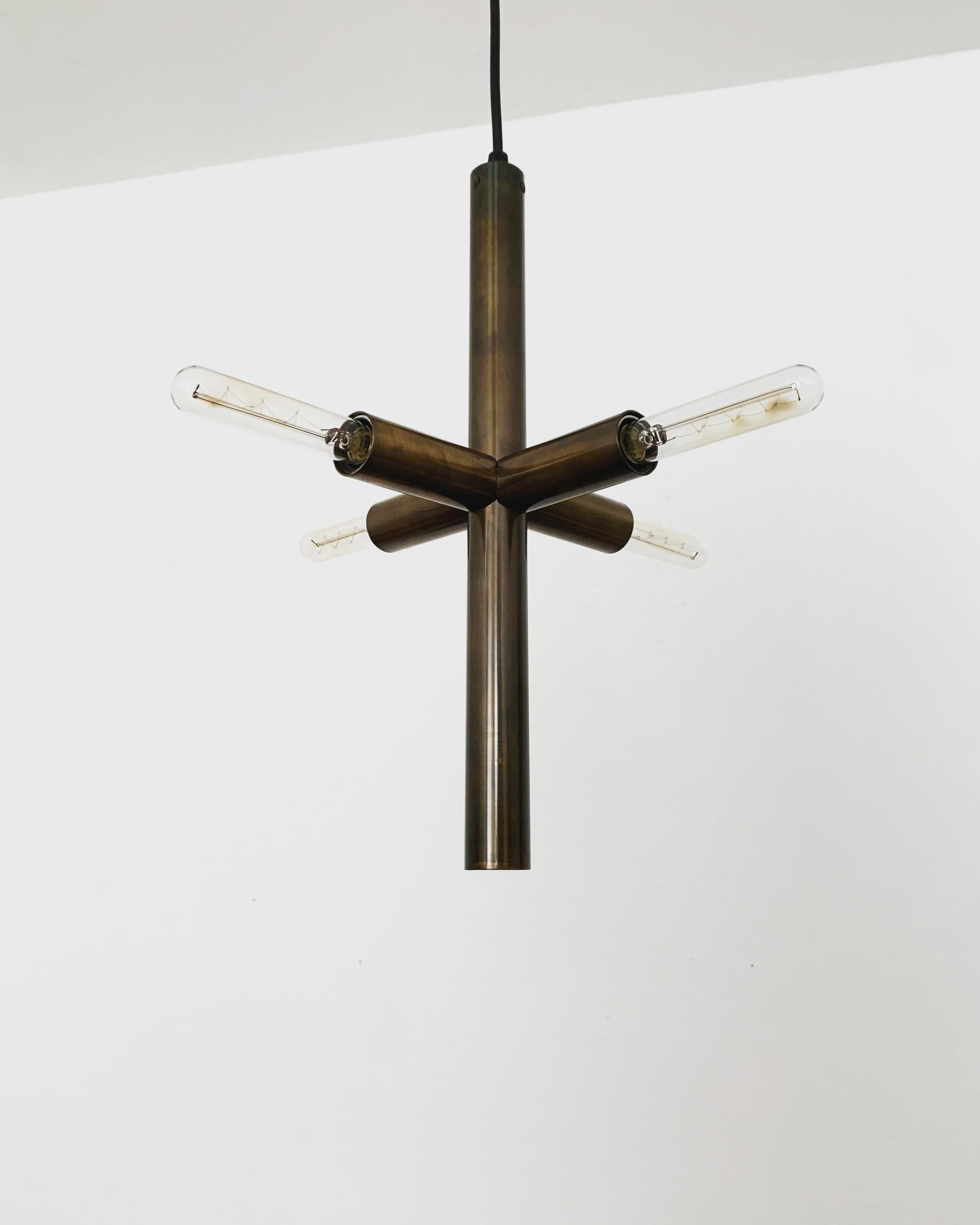 Beautiful brass pendant lamp from the 1960s.
Very high quality workmanship and fantastic reduced design.

Condition:

Very good vintage condition with slight signs of wear consistent with age.
Minimal patina on the metal parts.

The pictures