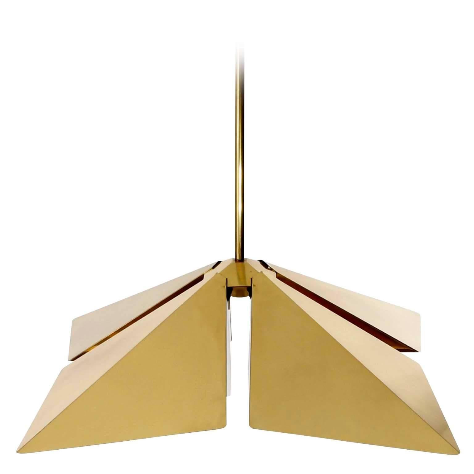 A square brass pendant light fixture manufactured by Vereinigte Werkstätten Munich, Germany, in Mid-Century, circa 1970 (late 1960s or early 1970s).
This gorgeous fixture is made of solid polished brass which has an aged surface in a rich and warm