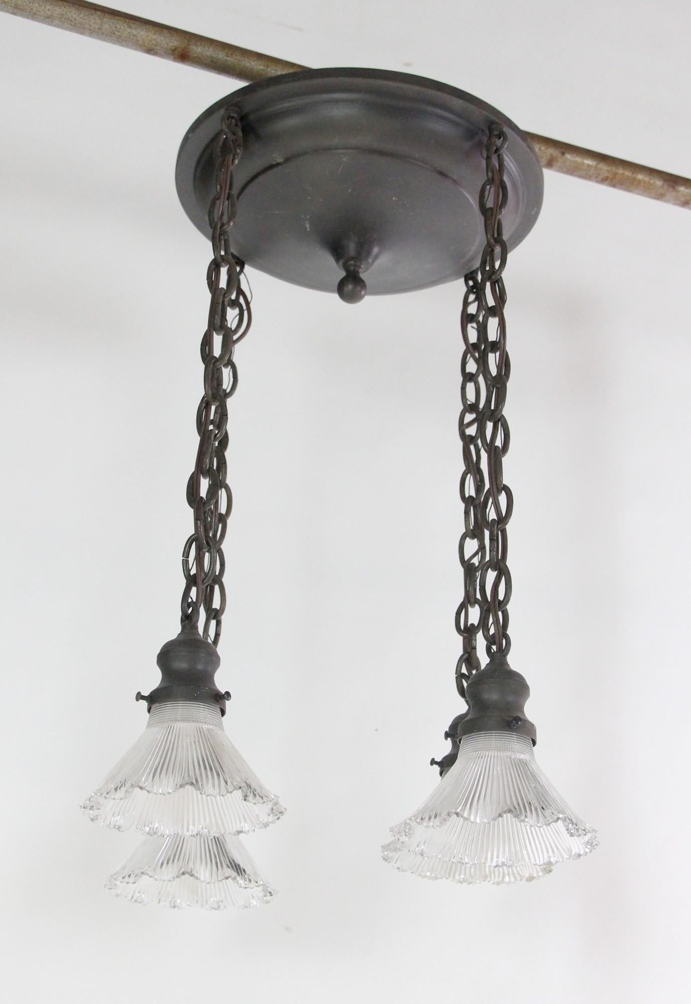 Brass Pendant Light w/ 4 Hanging Down Lights & Antique Holophane Glass Shades In Good Condition In New York, NY