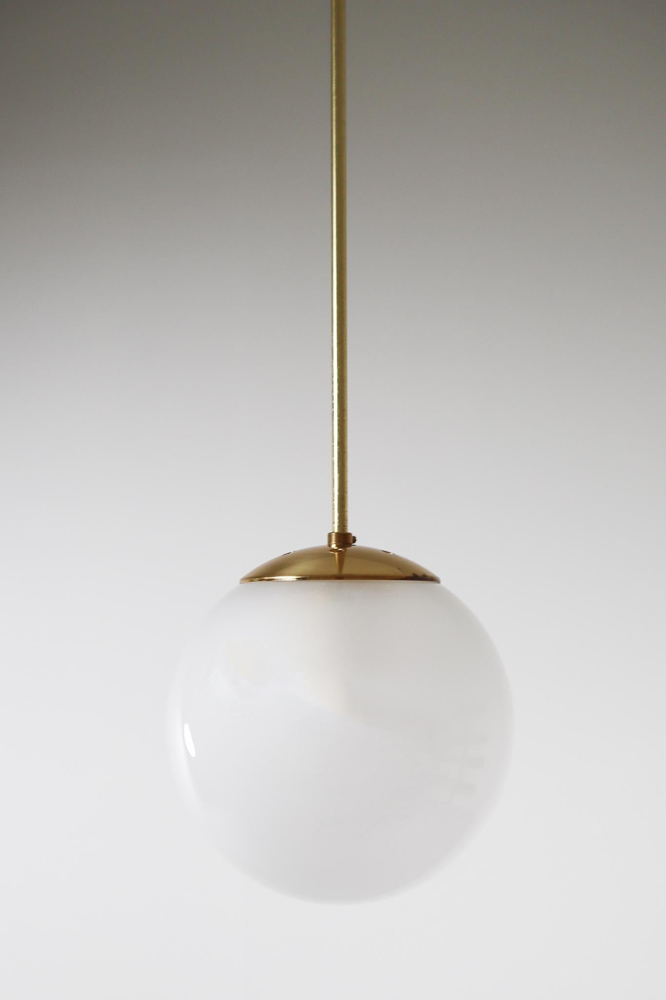 Mid-Century Modern Brass Pendant with a Pearl-White Hand Blown Globe by Preciosa Kamenický Šenov For Sale