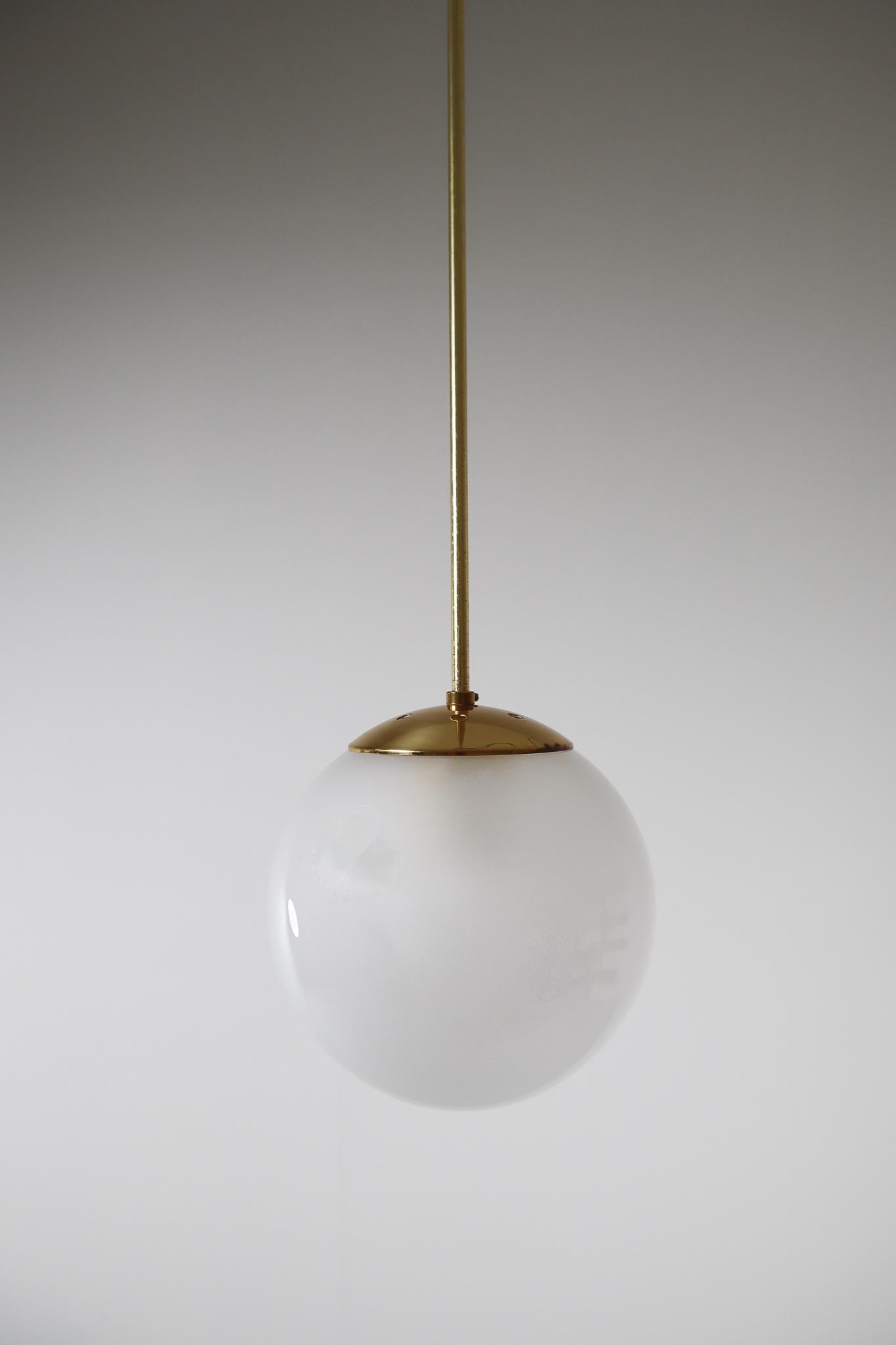 Late 20th Century Brass Pendant with a Pearl-White Hand Blown Globe by Preciosa Kamenický Šenov For Sale