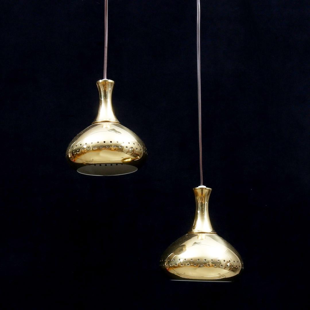 Brass pendant in ognion design partially performed designed by Hans Agne Jakobsson in the 1950s.
Two pieces available.