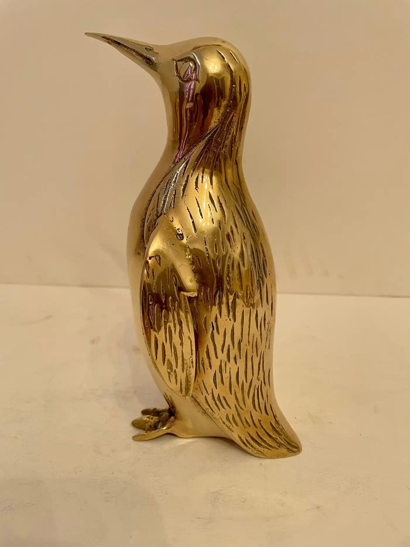 Vintage Hollywood Regency brass Penguin sculpture. Nicely detailed. Hand polished. Good overall condition. Dark spots are reflection of light in photos. Measures 8” tall x 4” wide x 4.25” deep. QUICK SHIP