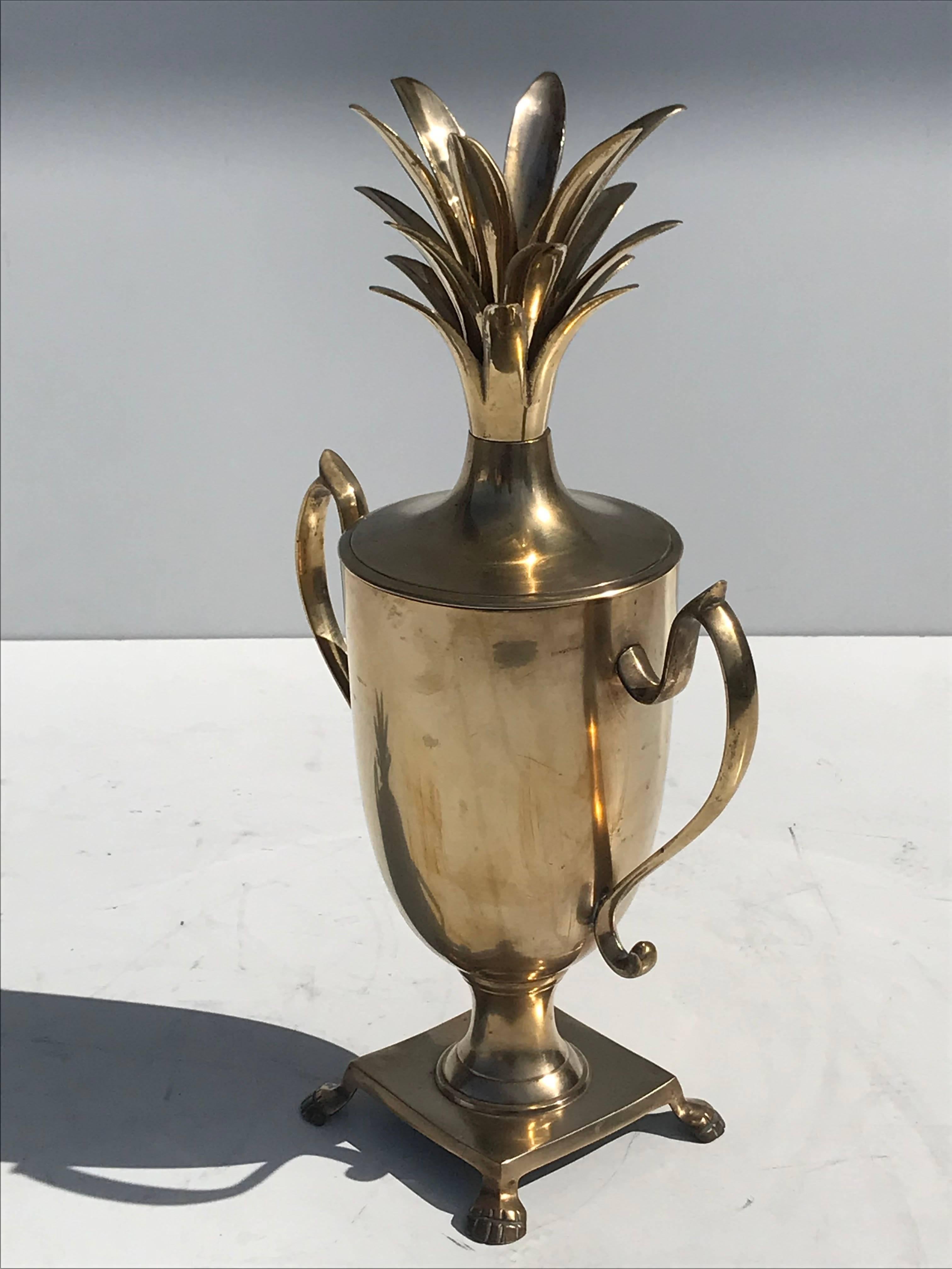 Brass pineapple urn beverage cooler.