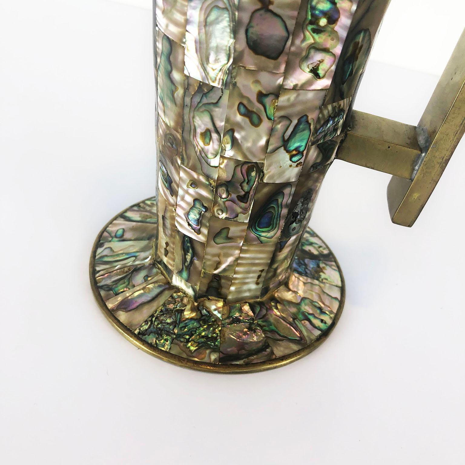 We offer an spectacular fine sample of traditional Mexican abalone inlay work. The pitcher is marked on the underside Hecho en Mexico, circa 1960.