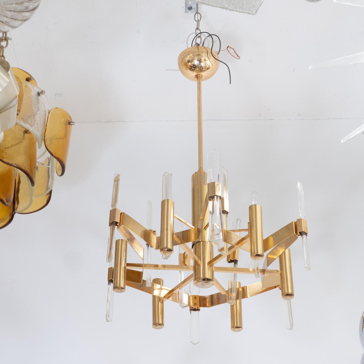 Brass plated chandelier featuring crystal prism details by Sciolari.