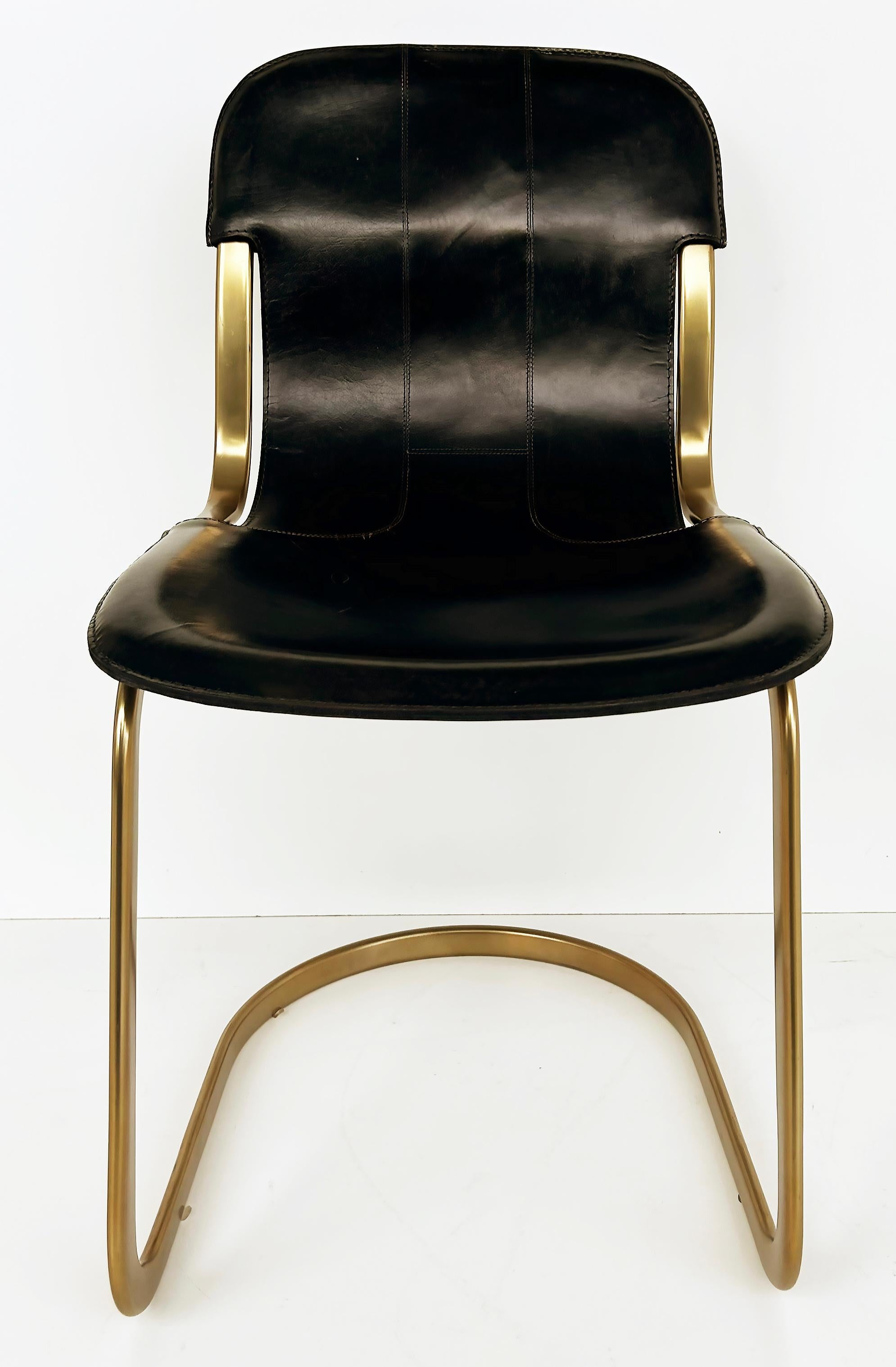 Brass Plated Leather Cantilevered Dining Chairs After Willy Rizzo Set of 6

Offered for sale is a set of six brass plated and stitched leather cantilevered dining chairs after a Mid-century Modern design by Willy Rizzo. The chairs have a great look