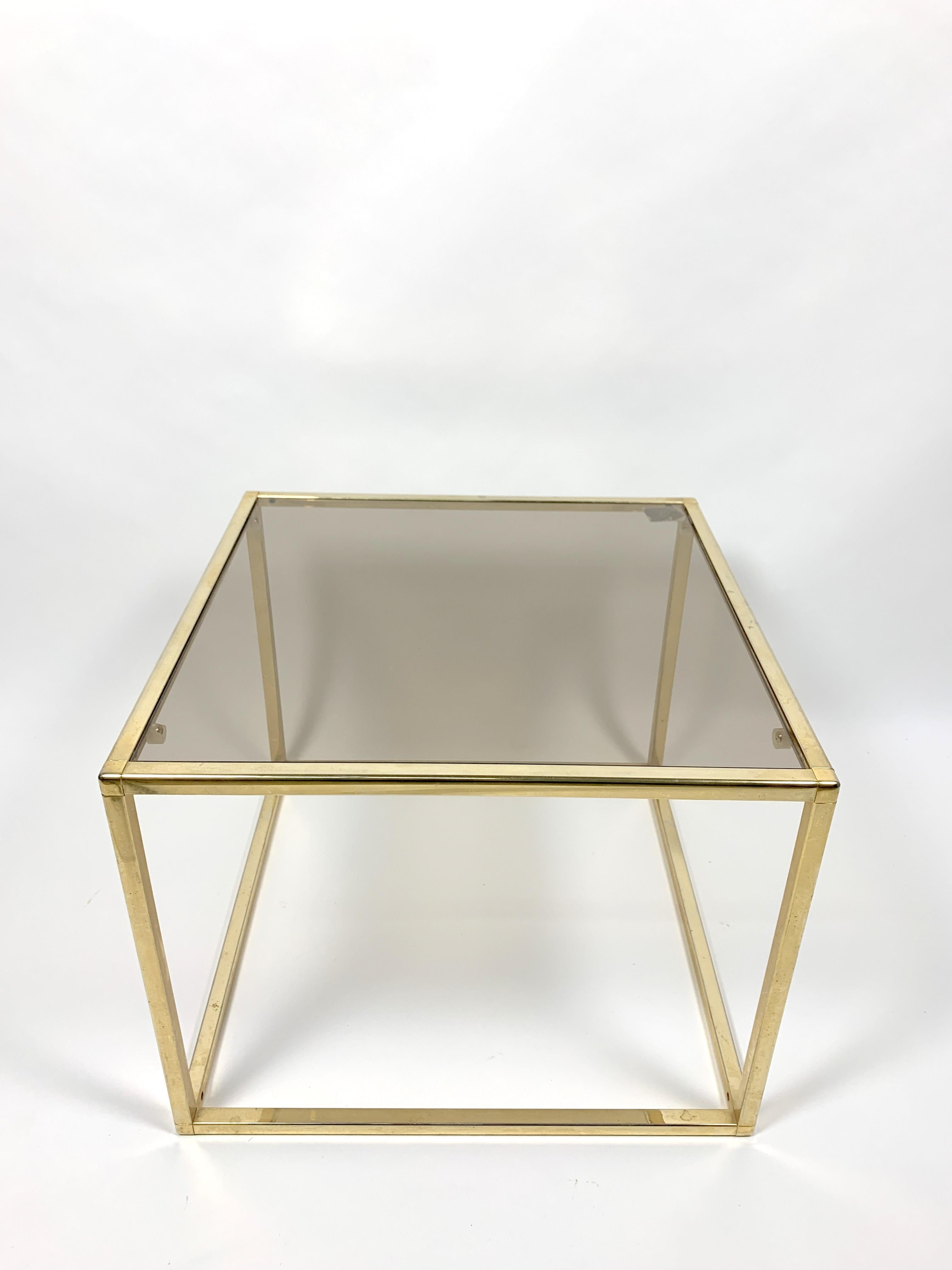 Brass-plated rectangular small table with glass top, 1970s. Great condition.