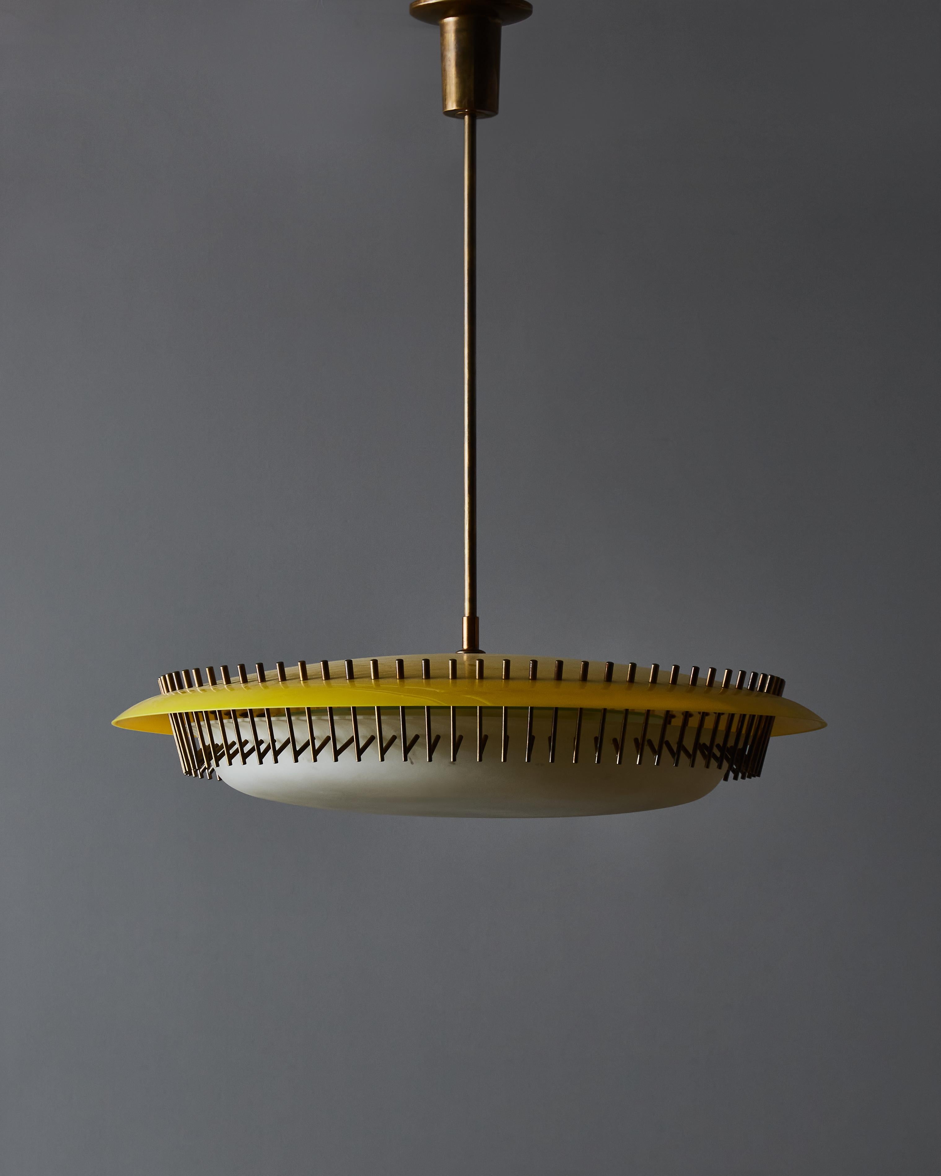 Rare chandelier model 12697 designed by Angelo Lelli for Arredoluce in 1958.
It’s made of a frosted glass bowl hold by distinctive brass hooks attached to a plexi dome in the signature yellow colour of Arredoluce.
 