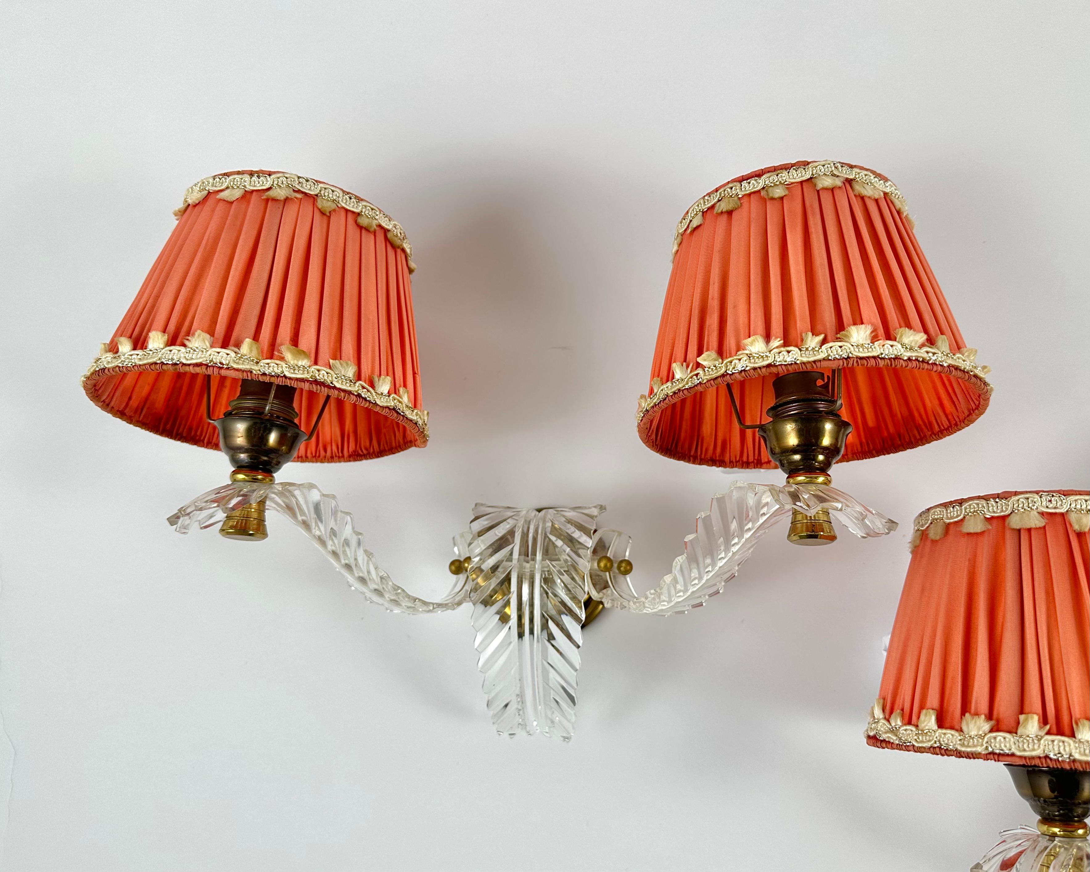 Convert your space into a 1970s glamorous room with this wall lights. 

Manufactured in France.  

The lamp is a combination of plexiglass and brass with a carefully selected textile shade, which creates a very elegant lamp.

It’s perfect not only