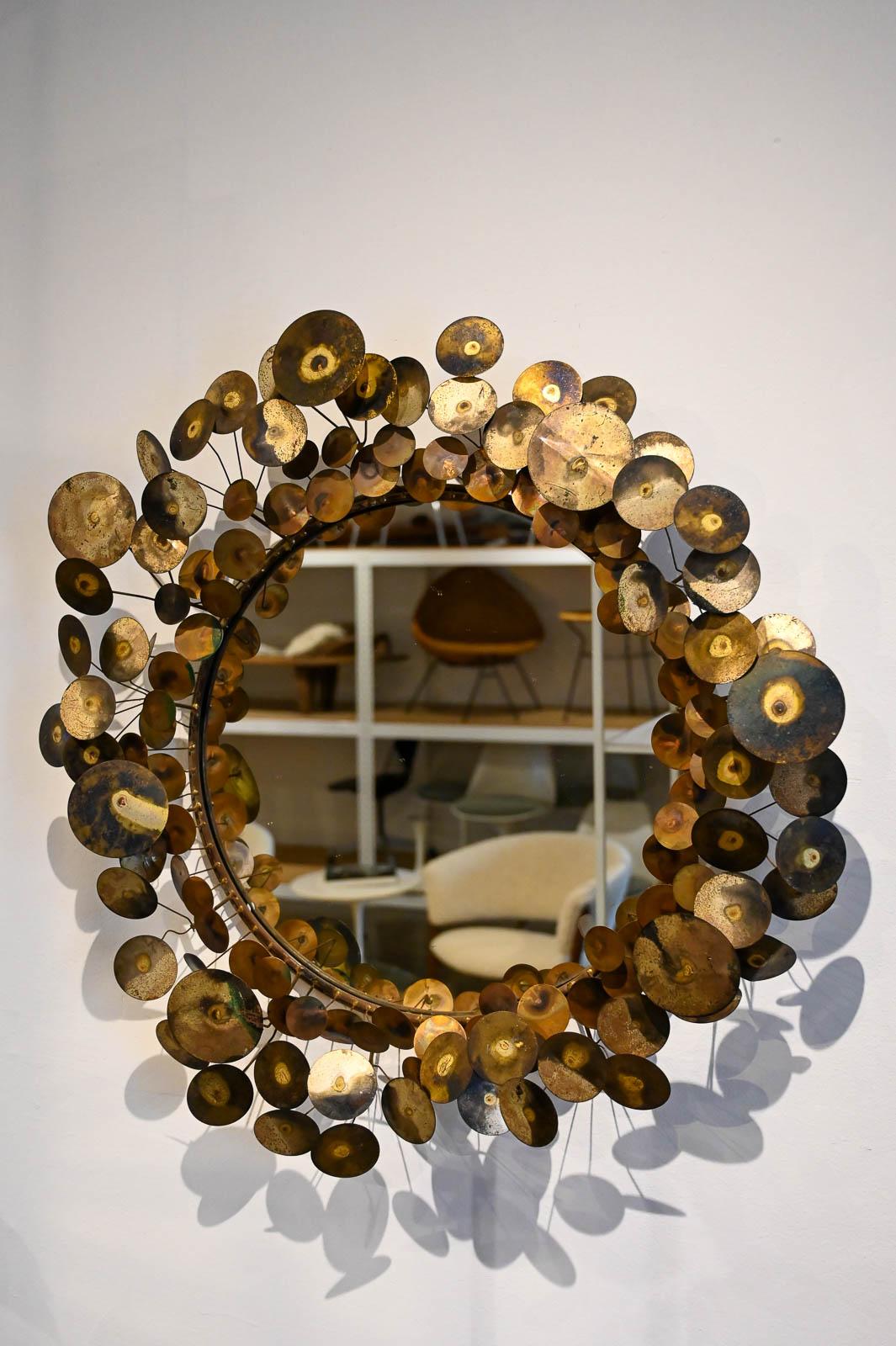 Brass Raindrops Mirror by Curtis Jere, circa 1968. Original vintage piece, not a current reproduction. Wonderful brass patina, original glass. Ready to hang, weighs approximate 30 lbs. Measures: 32