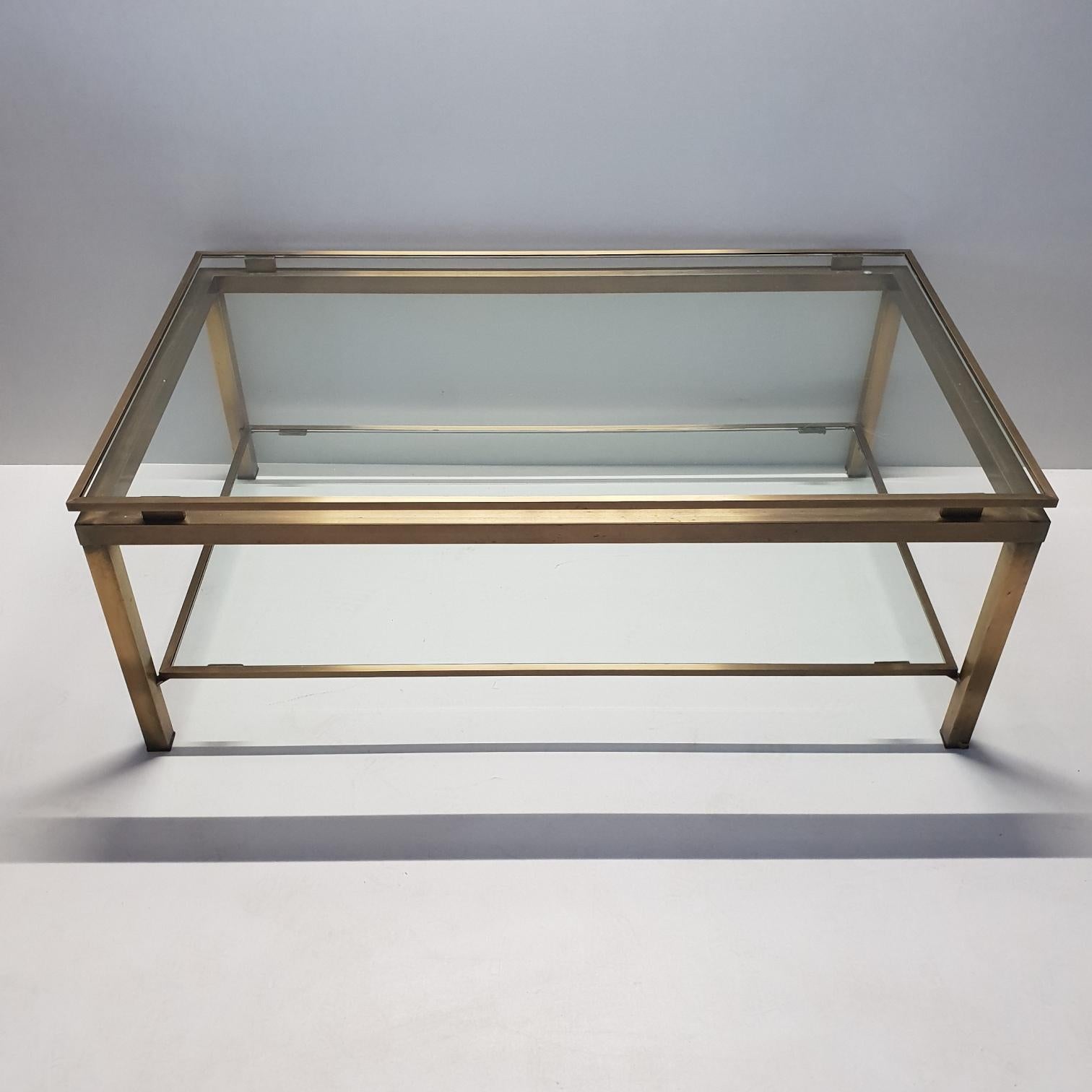 Brass rectangular 2-tiers coffee table by Maison Jansen, 1970s.
With a brushed brass frame.