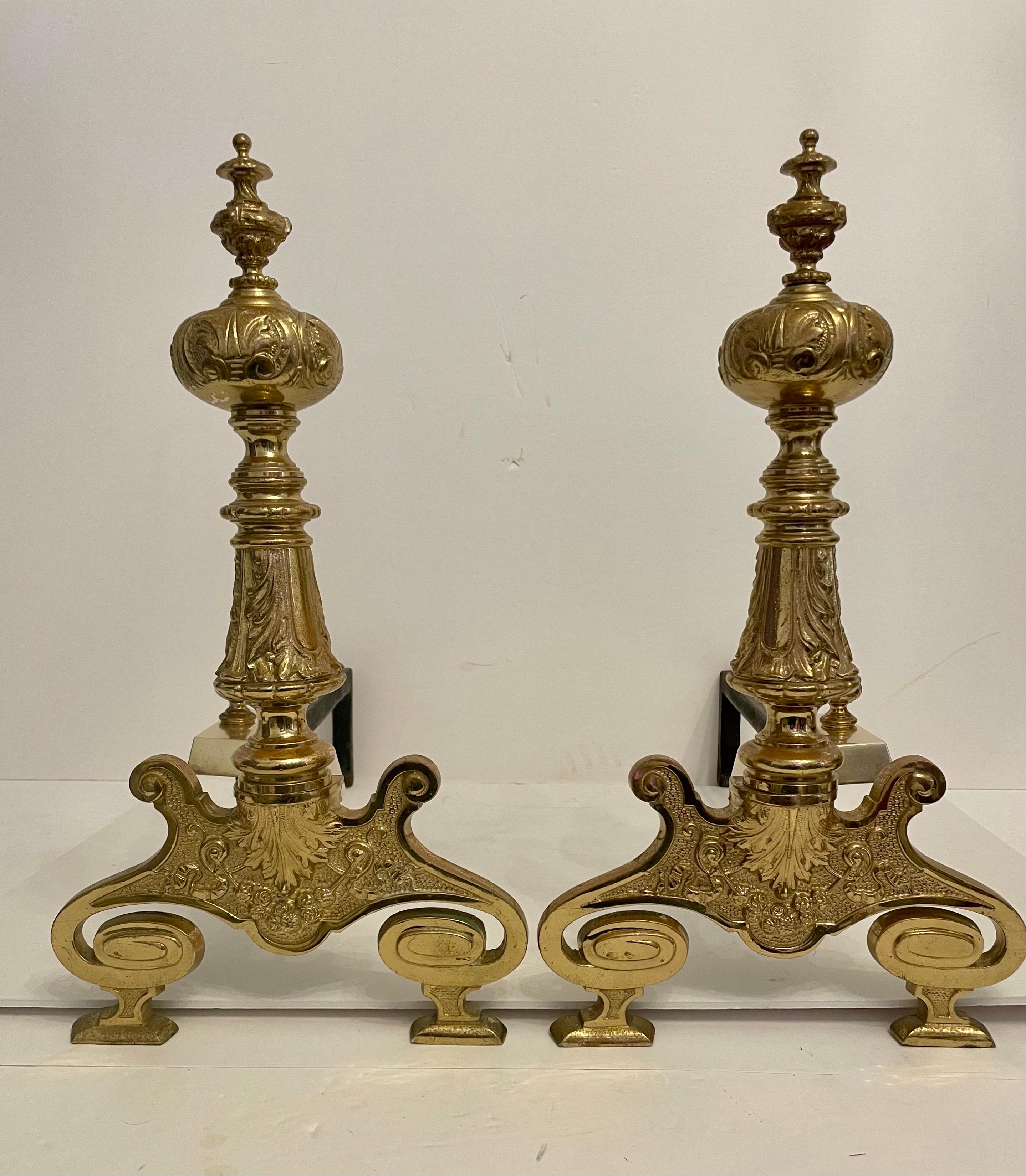 Nice brass Rococo Revival Style fireplace andirons. Brass is in good condition with nice details in the casting. Measure 18