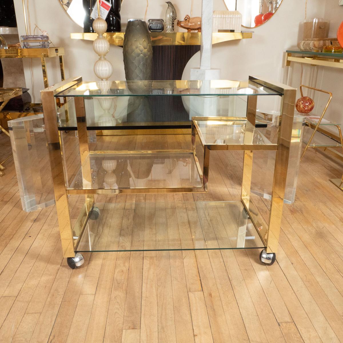 Mid-Century Modern Brass rolling bar cart with glass shelves For Sale