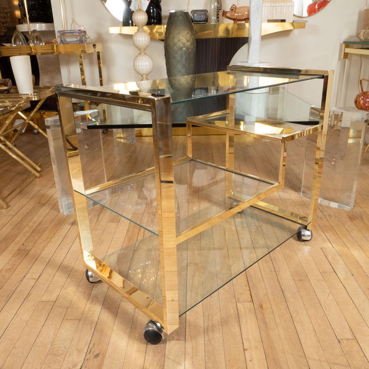 Italian Brass rolling bar cart with glass shelves For Sale