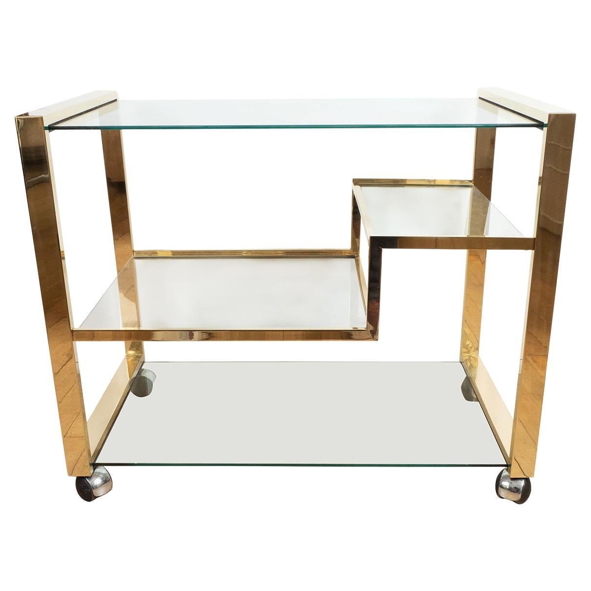 Brass rolling bar cart with glass shelves For Sale