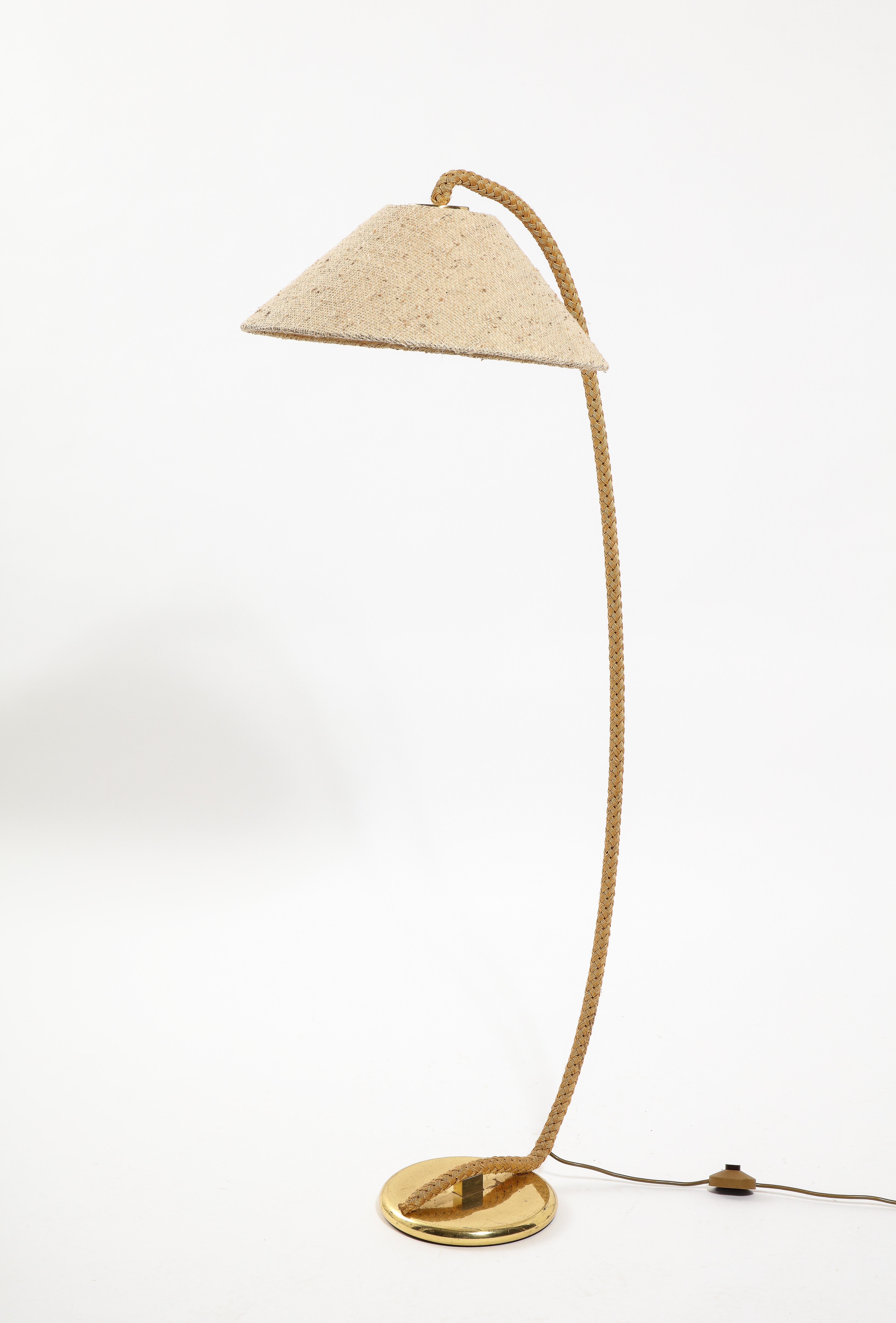Brass reading lamp wrapped in rope with its original shade.