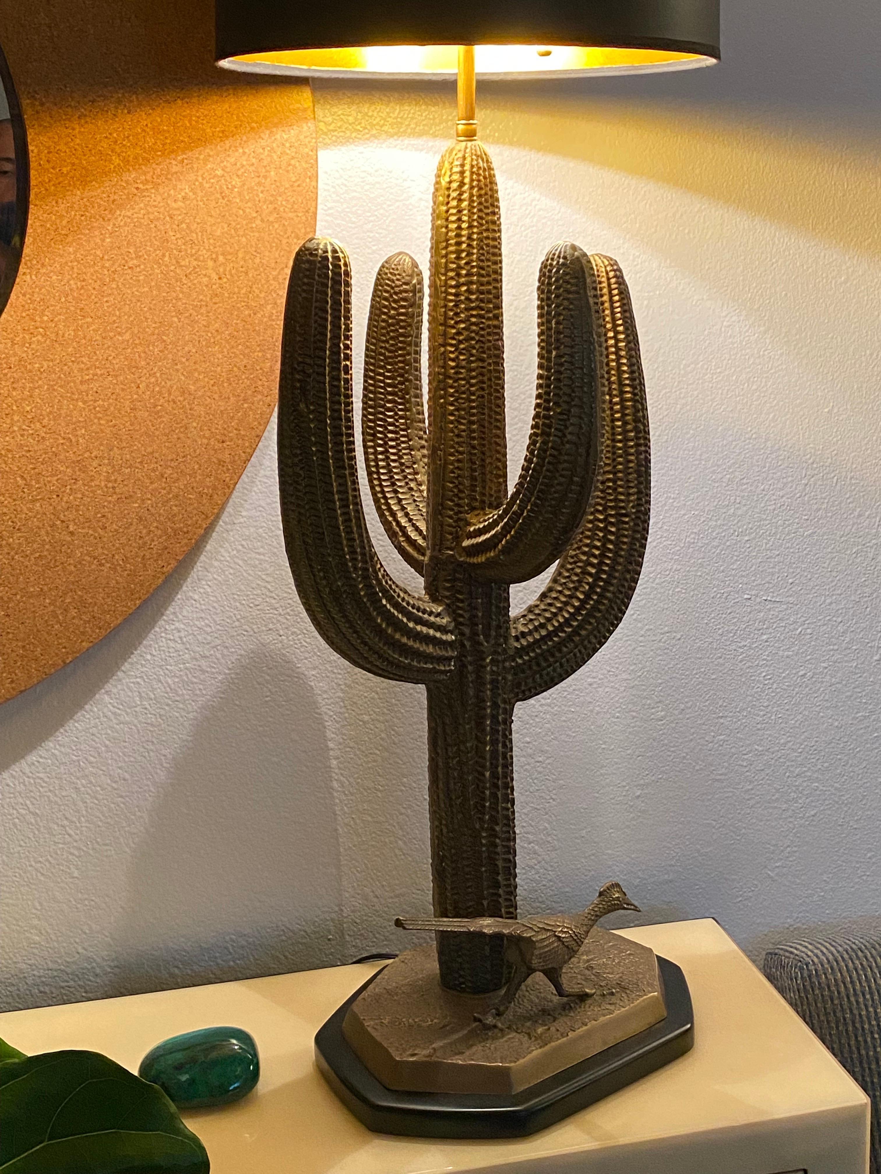 Brass Saguaro cactus lamp with roadrunner. Newly wired and requires two up to 60watt bulbs. Lampshade is not included.