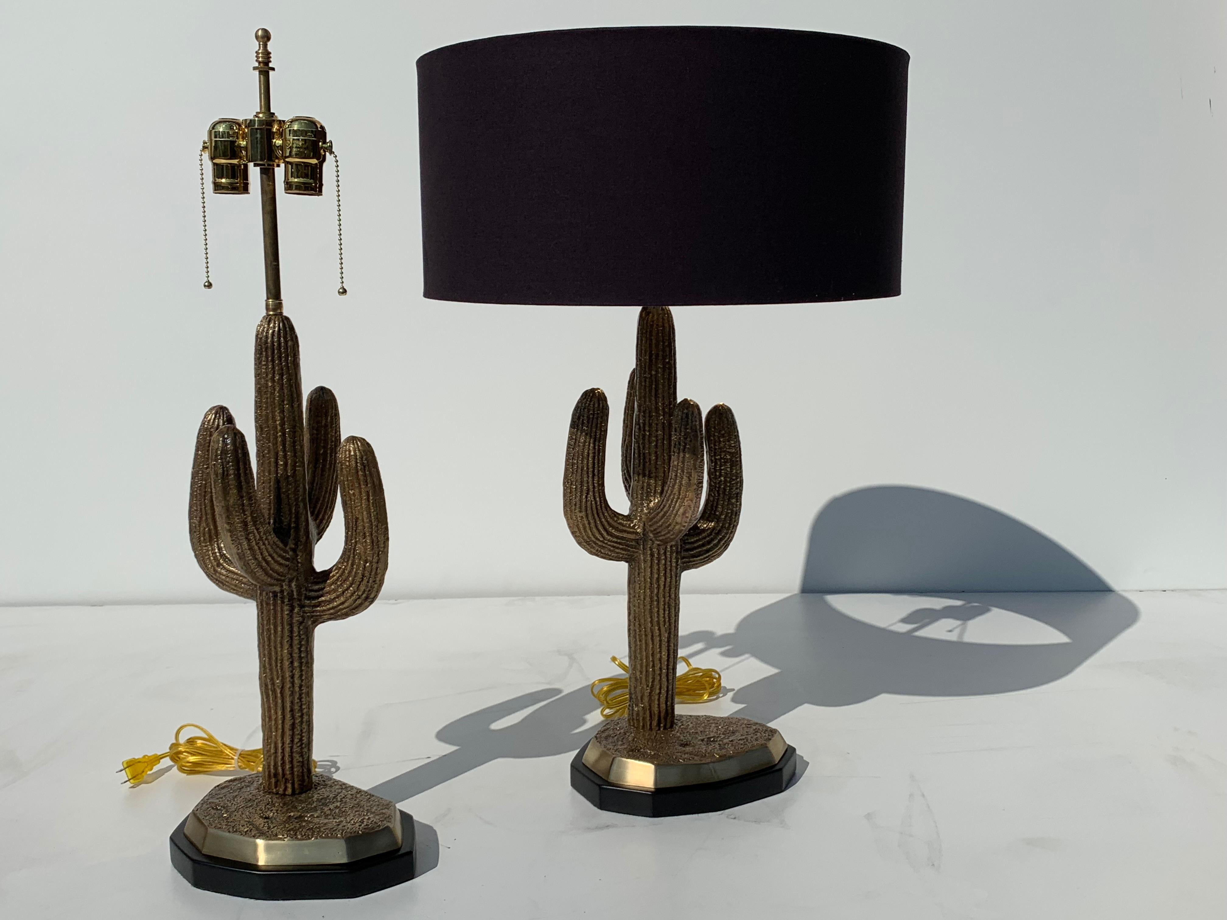 Pair of brass saguaro cactus lamps. Double cluster with max 60watt bulbs. 
Lampshade shown is 18