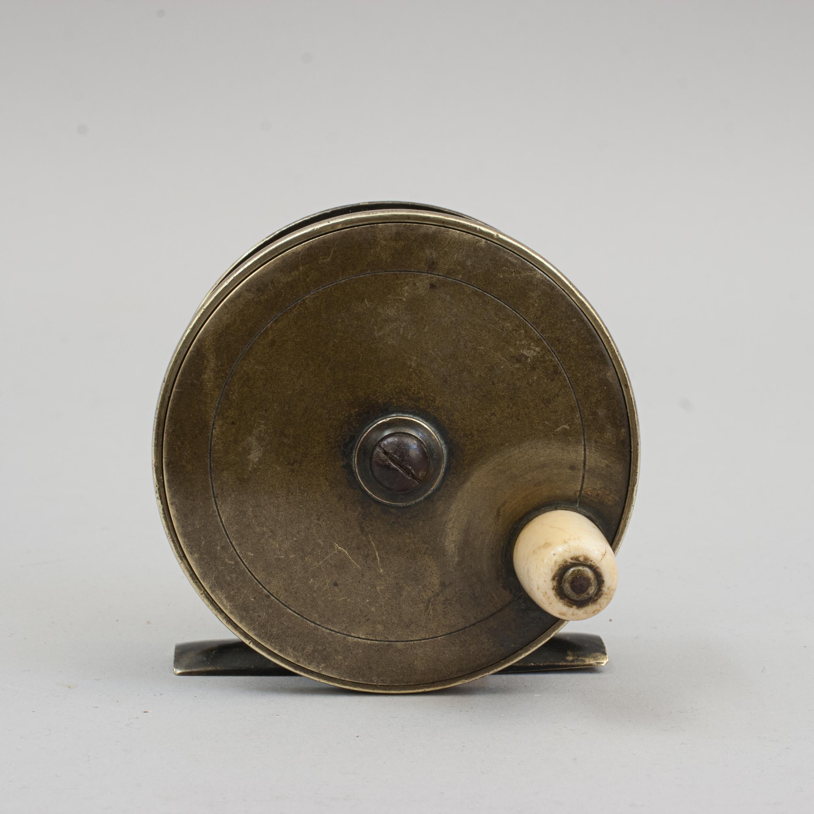Brass Fishing Reel By Farlows.
A very good 3 inch brass fishing reel by Farlow, London. The reel has a lovely patina, brass foot plate (stamped with farlow's 'fish' logo) and a single horn handle. The back plate engraved 'Chas. Farlow & Co., Makers