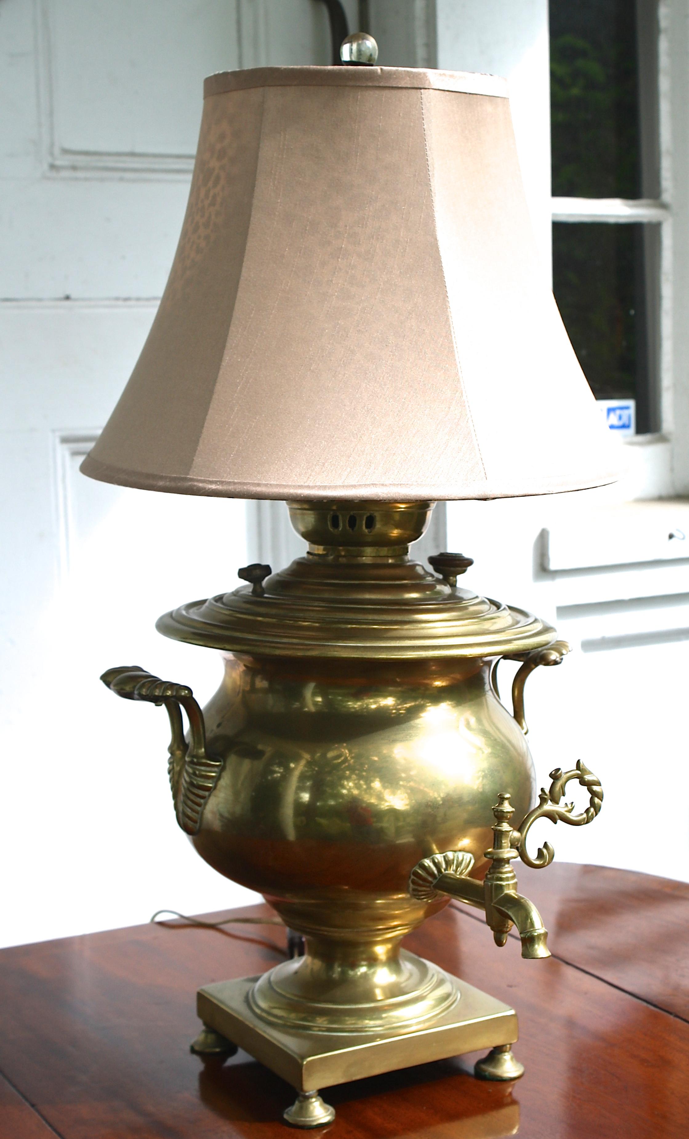 Dating from the reign of Alexander III (1881-1894), a Russian brass samovar mounted as a table lamp in the mid-late 20th century. Structurally intact with minimally invasive mounting. The samovar measures 17 inches tall by 16 inches diameter. The
