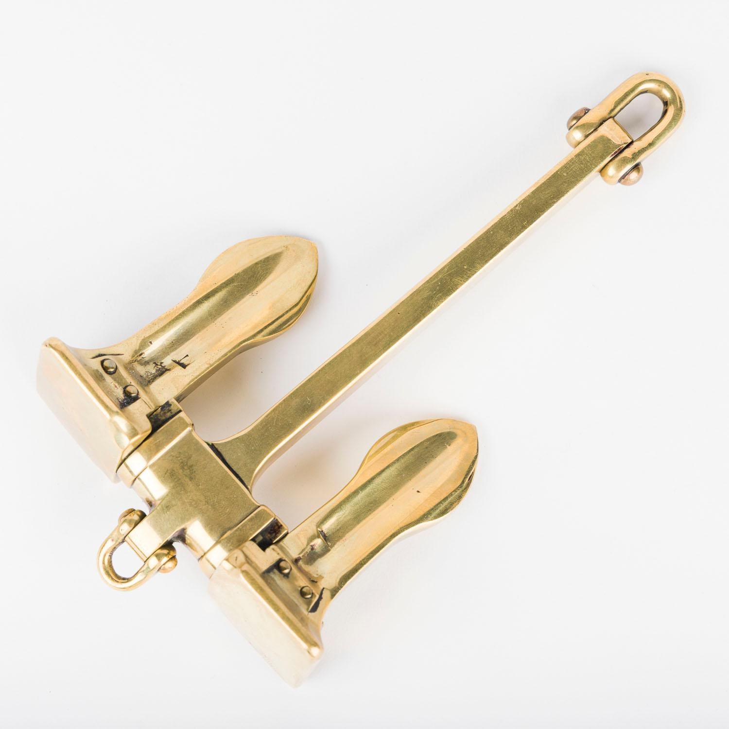 A brass scale model of a ship’s stockless anchor, circa 1900.

A stockless anchor (or “patent anchor”) is a streamlined derivation of the traditional Admiralty anchor used aboard large ships. Patented in England in 1821, it eliminated the stock