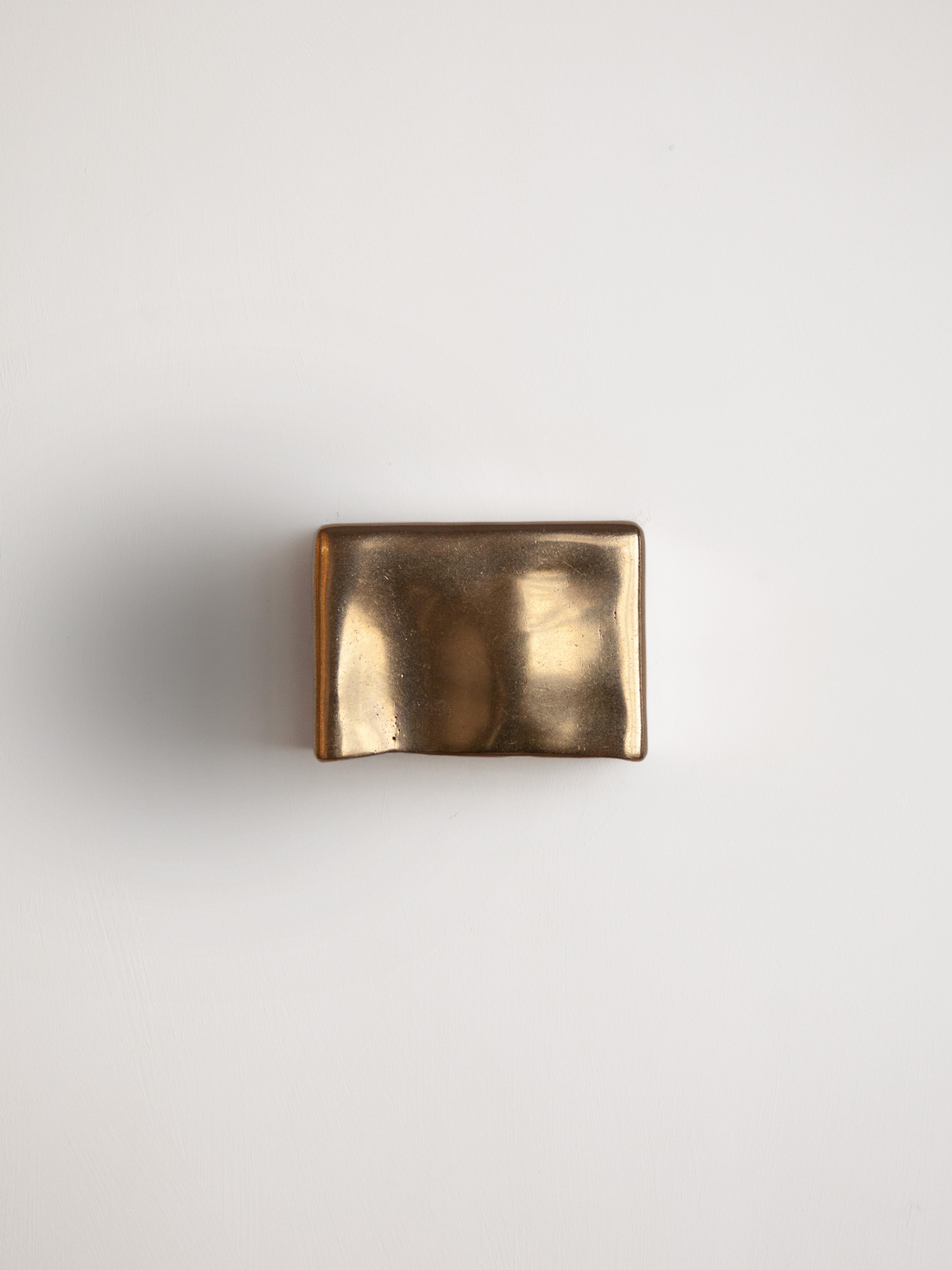 Brass Scape Wall Light by Stem Design
Dimensions: D 9 x W 16 x H 12 cm. 
Materials: Cast brass.
Finish: Tumbled and burnished.
Weight: 3 kg.

Finished and assembled by hand in India. Also available in cast aluminum. Please contact us. 

Scape is