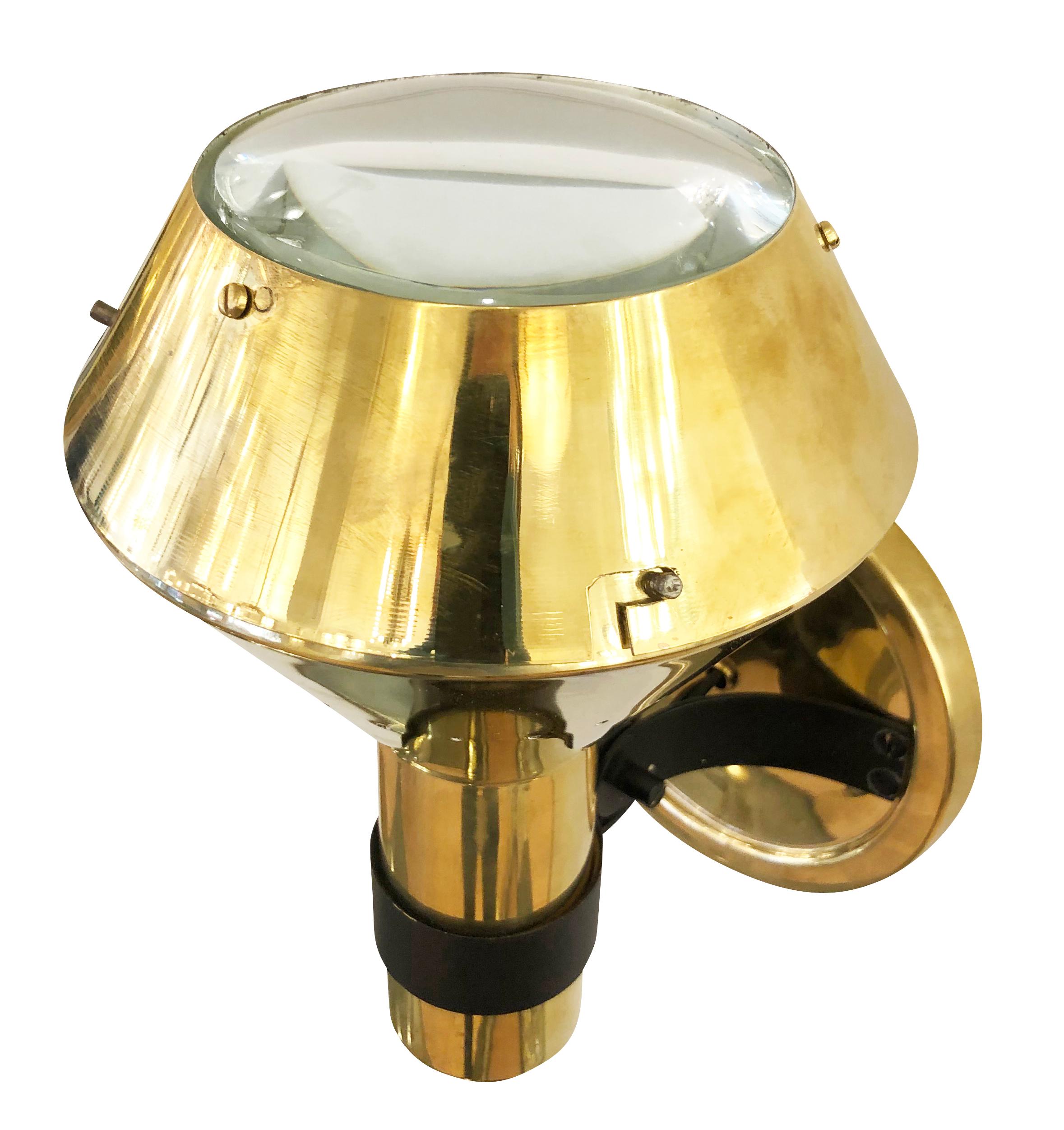 Brass sconces by Candle, a subsidiary of Fontana Arte. The shade is adjustable and ends with a thick glass lens. Can be mounted with the lens facing up or down. Price per pair. 3 pairs available.

Condition: Excellent vintage condition, minor wear