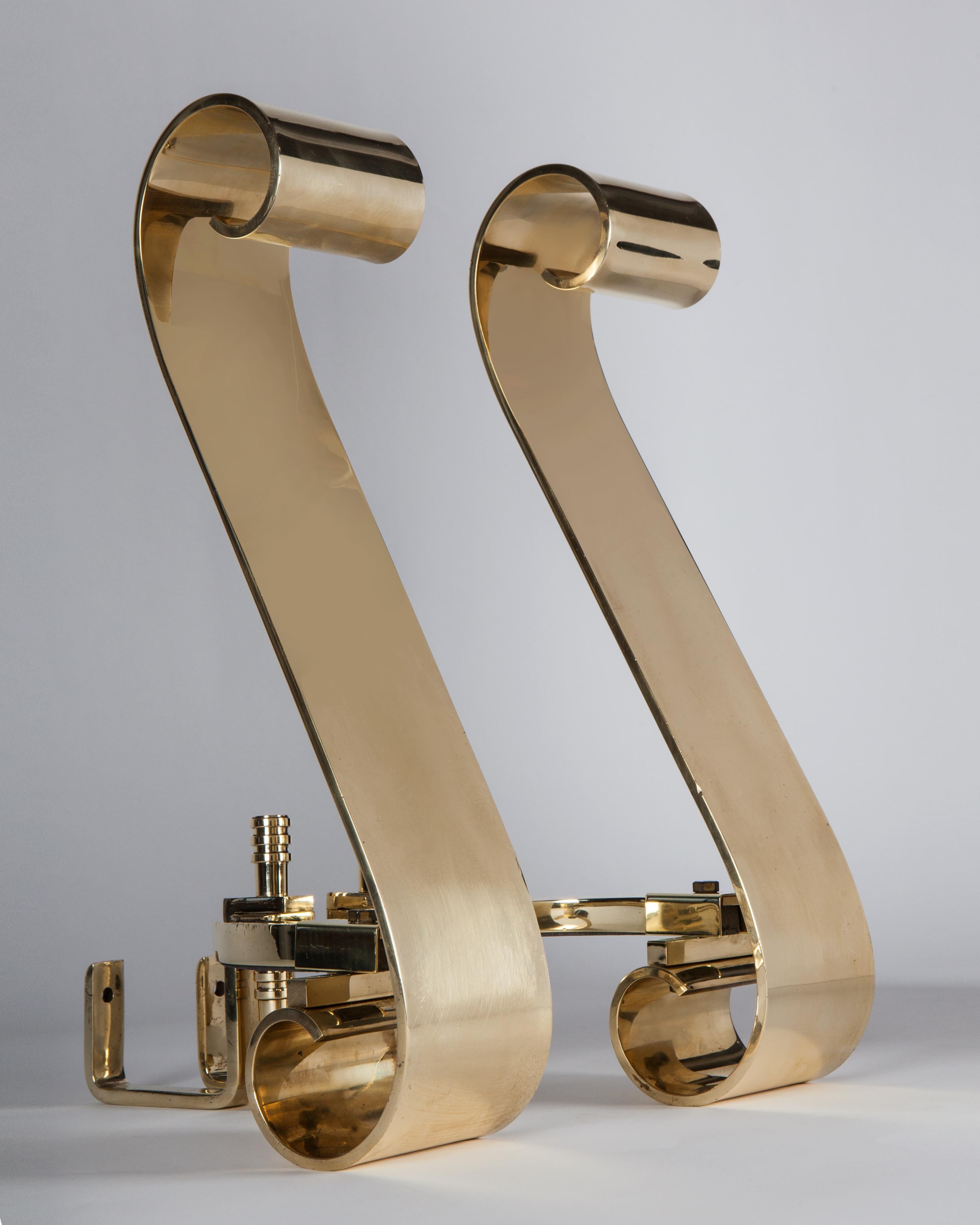 AFP0562
A pair of vintage solid brass andirons in the form of large, wide “S” scrolls with stepped and turned finials and legs.

Dimensions
Overall: 19-1/2