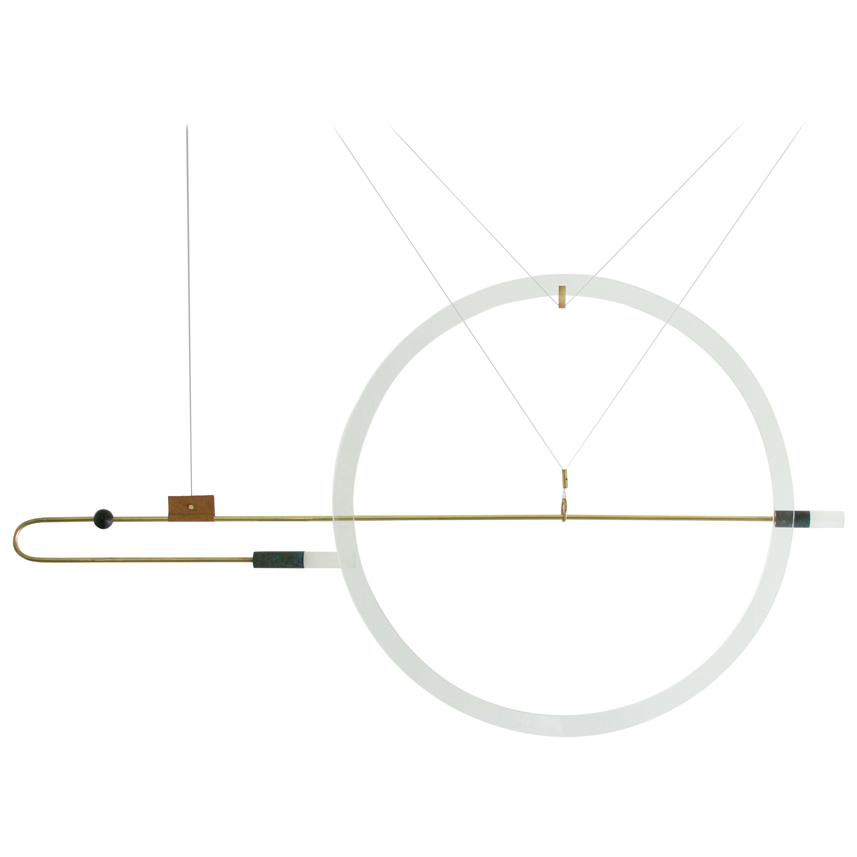 Sculpted light suspension - Portraits -Opus X – Periclis Frementitis.

Materials: solid brass (aged & polished) curved with fire on hand, bronze parts, handcrafted glass, handcrafted leather, acrylic parts, 12V LED

Dimensions: W 125 cm x H 65