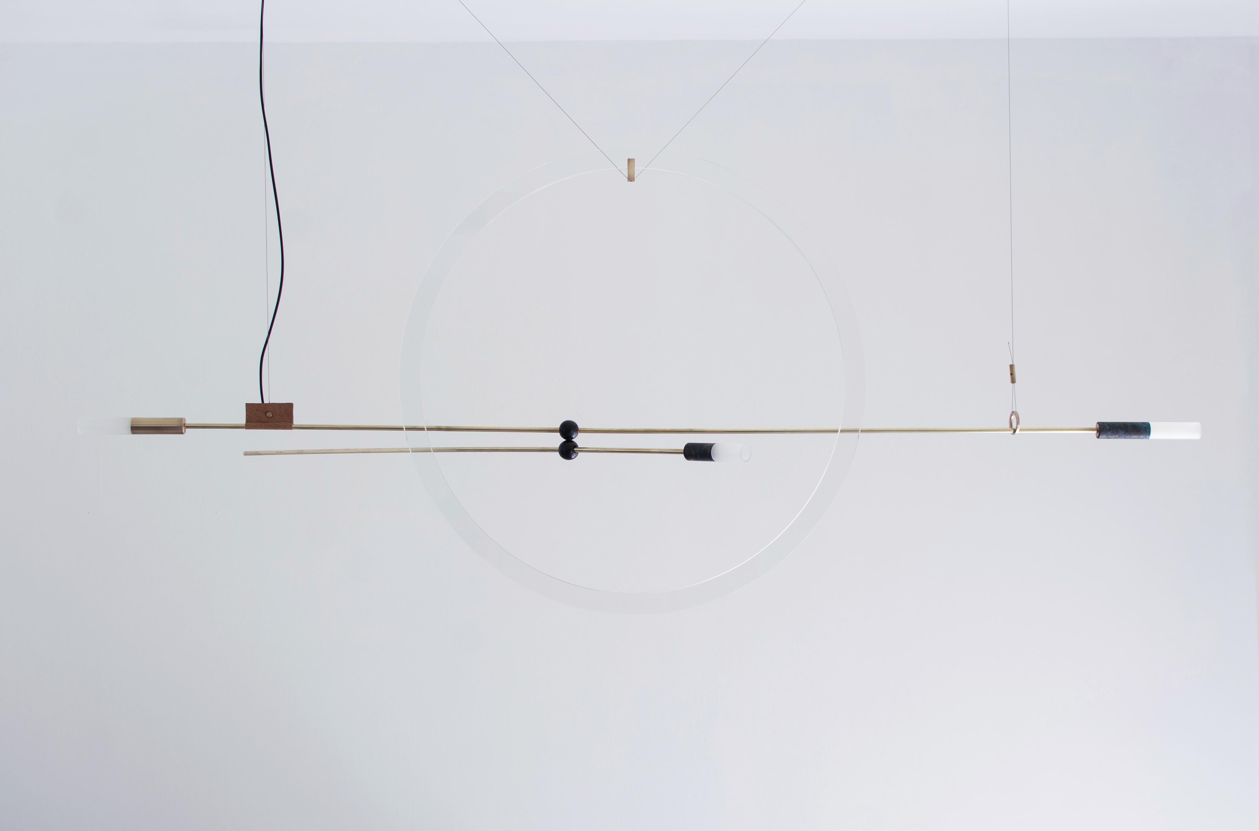 Brass sculpted light suspension 'Opus xi', Periclis Frementitis

Materials: solid brass (aged and polished), bronze parts, handcrafted glass, handcrafted
leather, acrylic parts, 12V LED

Dimensions: W 160 cm x H 65 cm x D 80 cm
Due to the