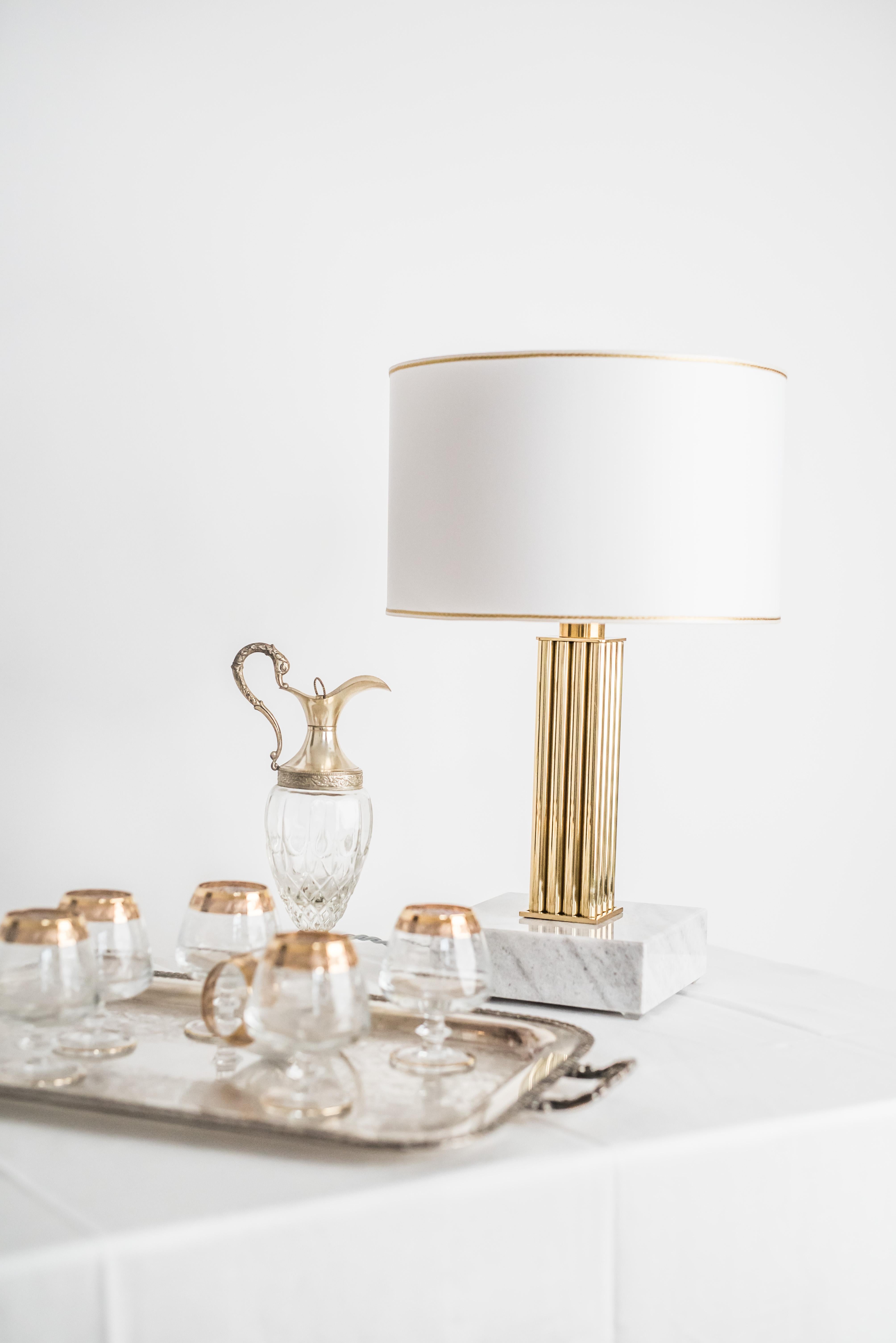 Brass Sculpted Table Lamp by Brajak Vitberg
ATHENS 1.1.
Mura marble (also available with carrara marble)
Polished brass
Dimensions: 53 x 35 x 35 cm
white or black cotton lampshade, cotton wiring


Bijelic and Brajak are two architects from