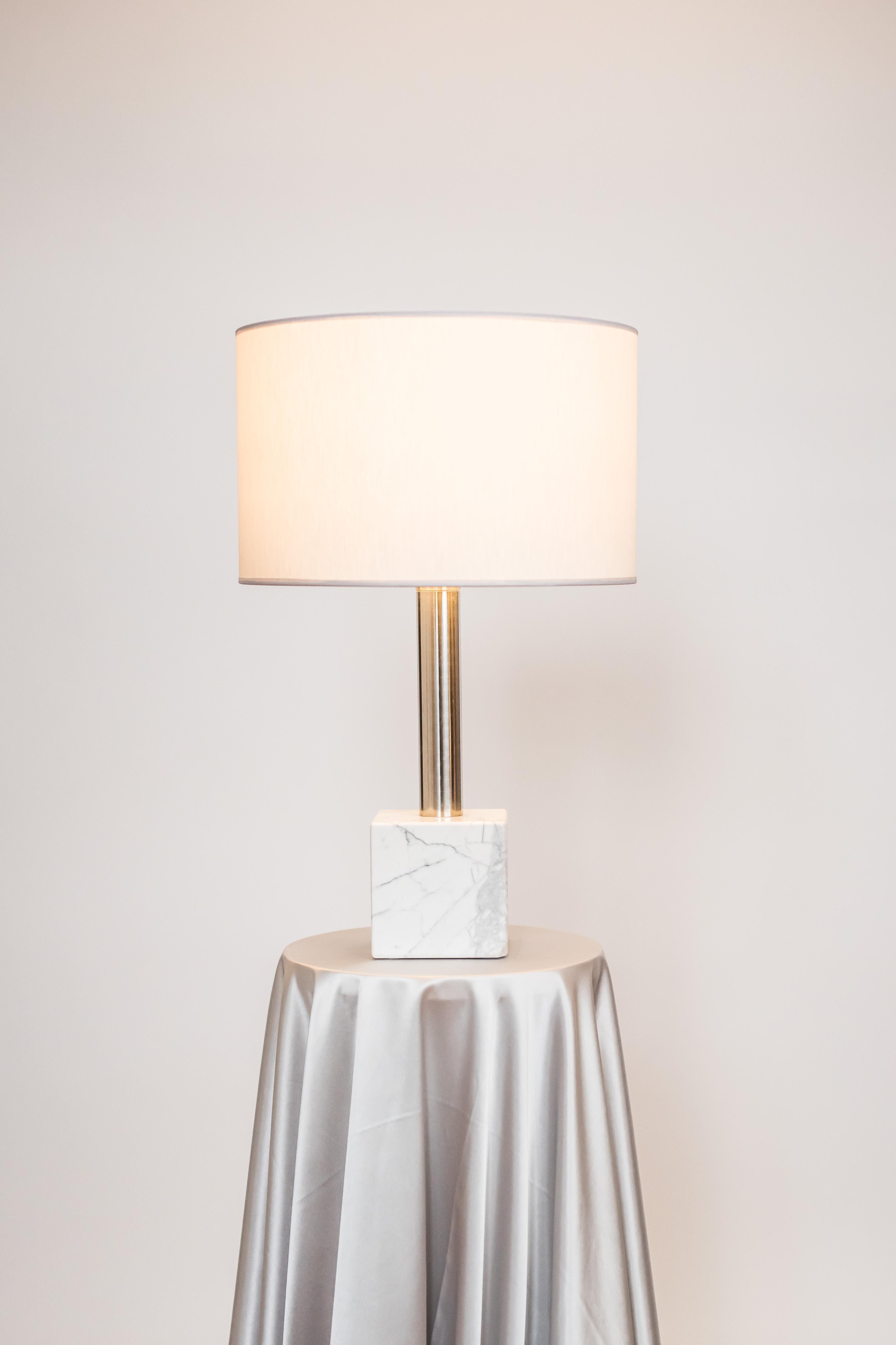 Brass sculpted table lamp by Brajak Vitberg
Athens 1.2
Mura marble (also available with Carrara marble)
Polished brass
Dimensions: 59 x 35 x 35 cm
white or black cotton lampshade, cotton wiring


Bijelic and Brajak are two architects from Ljubljana,