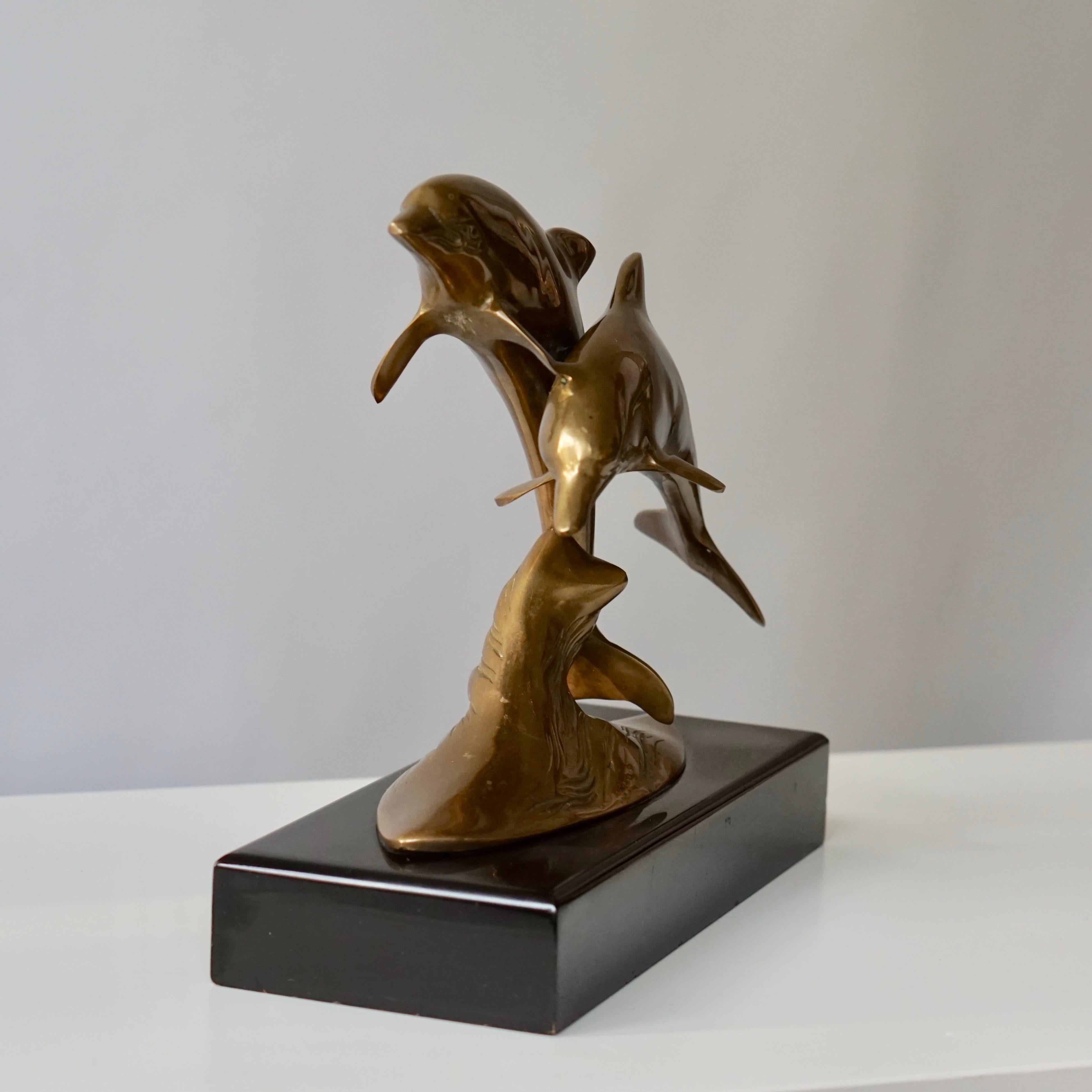 brass dolphin sculpture