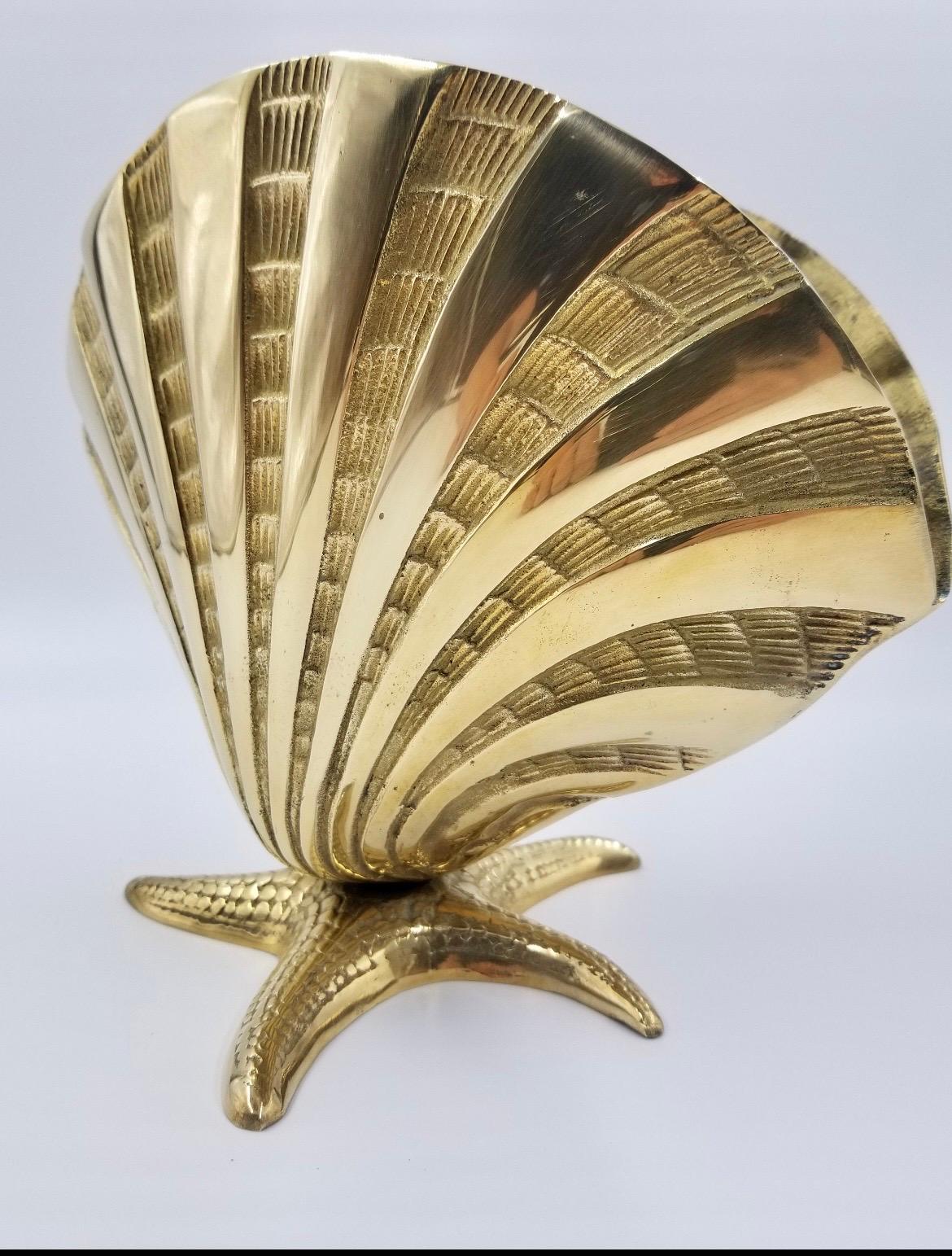 Large brass sea shell nautilus planter on starfish base. Very unusual design with nice detail. Overall nice condition. Ready for your beach house!