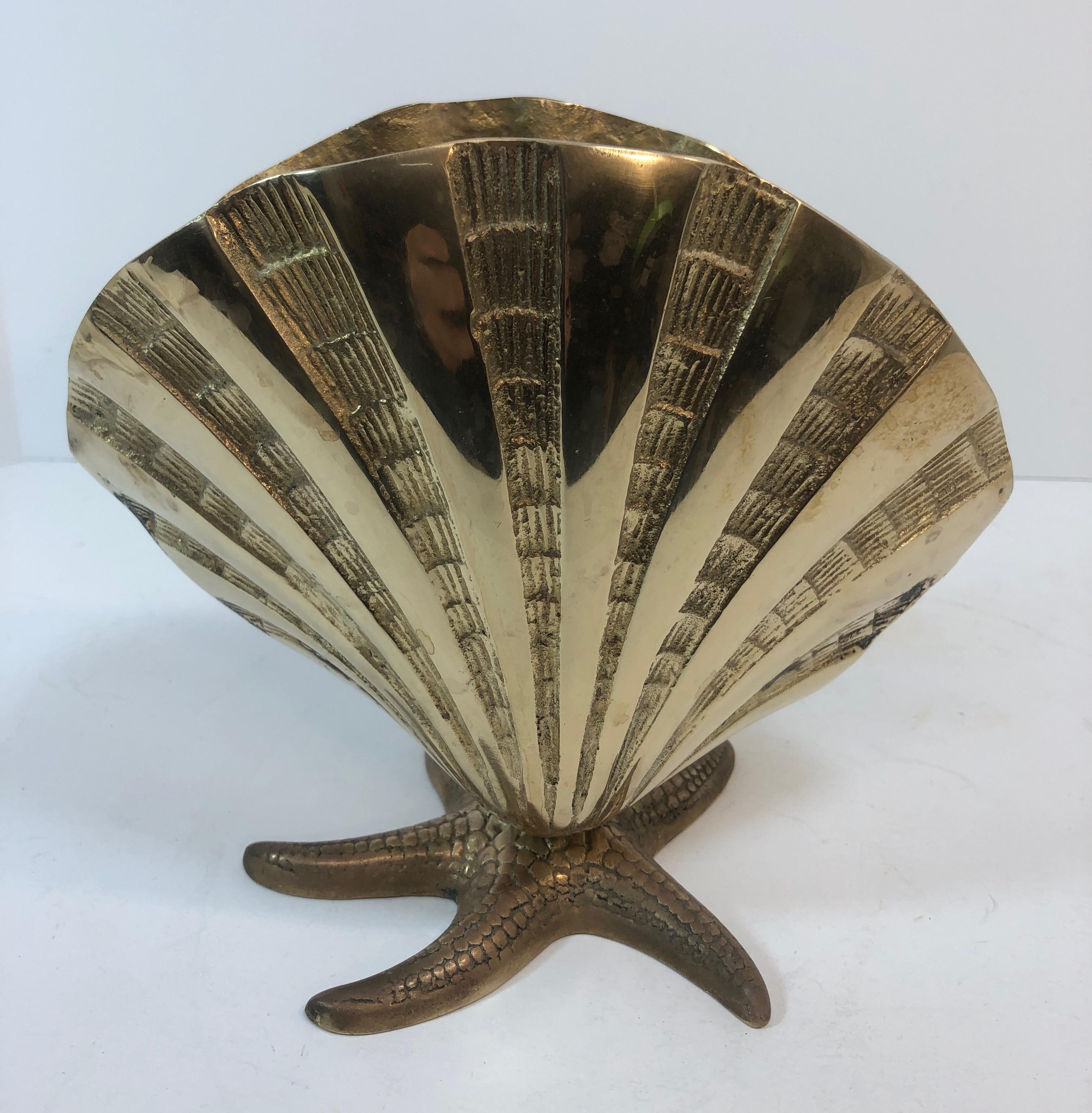 Large brass sea shell on starfish base. Very unusual design with nice detail. Some patina spots but overall nice condition. Ready for your beach house!