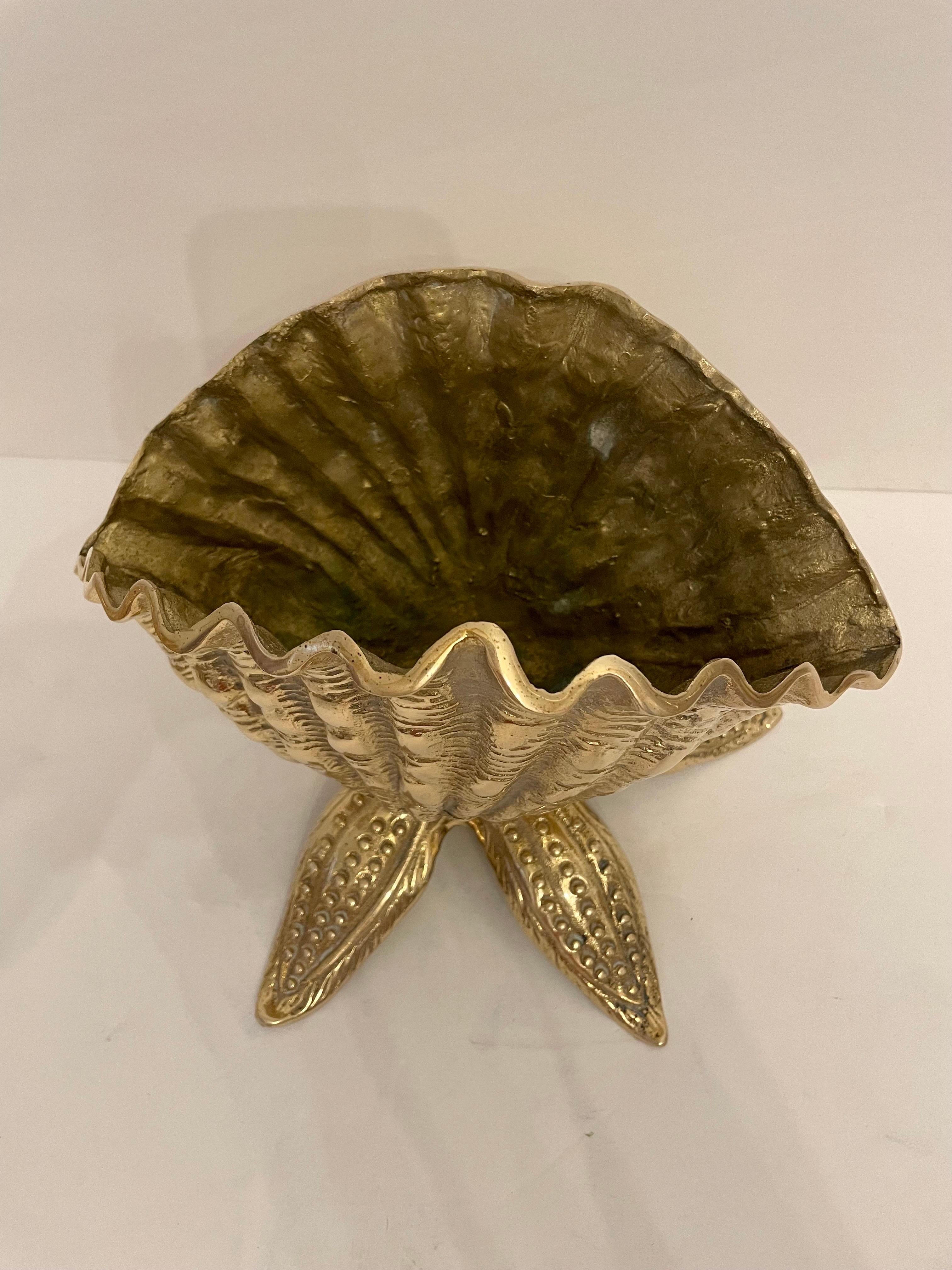 Cast brass seashell nautilus planter on starfish base. This is one planter of two matching planters. Good condition. Great for your beach house!