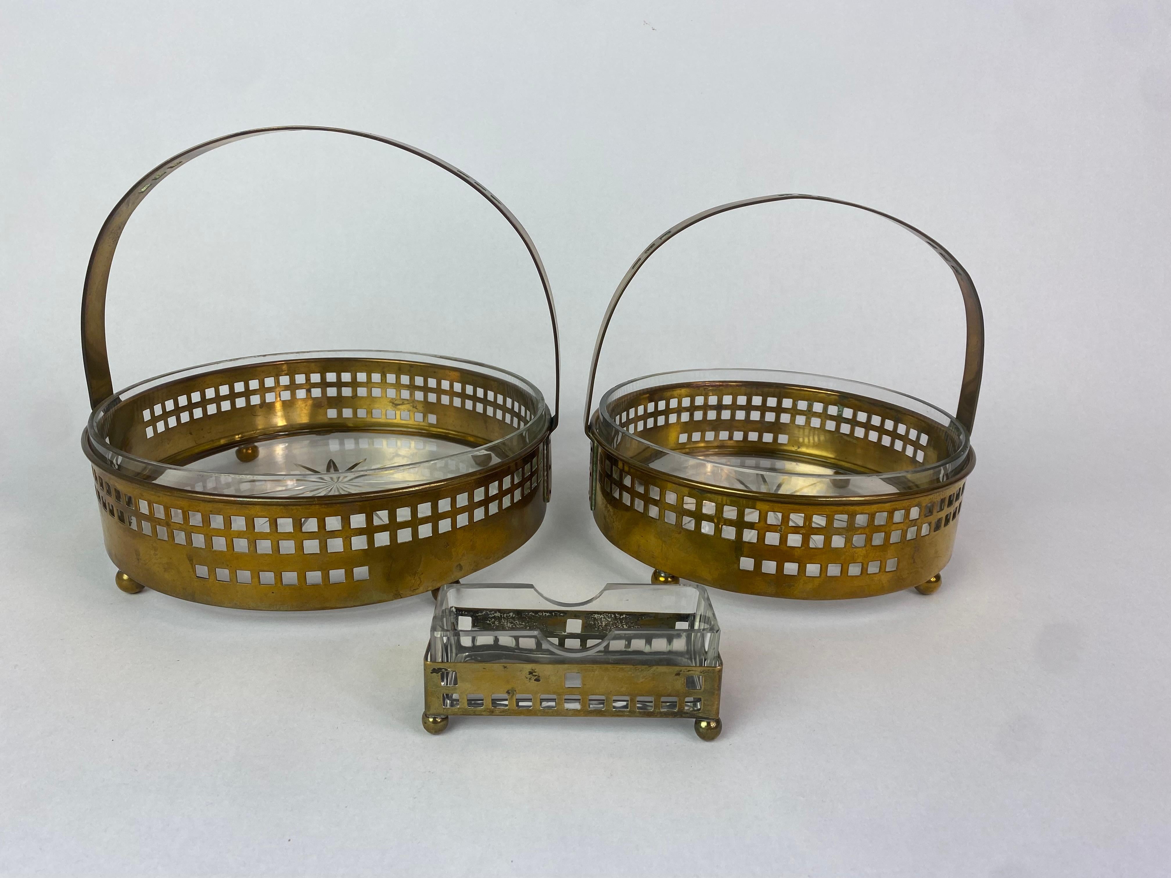 Brass secessionist baskets and toothpick holder by Hans Ofner/Josef Hoffmann with glass inserts in original vintage condition.