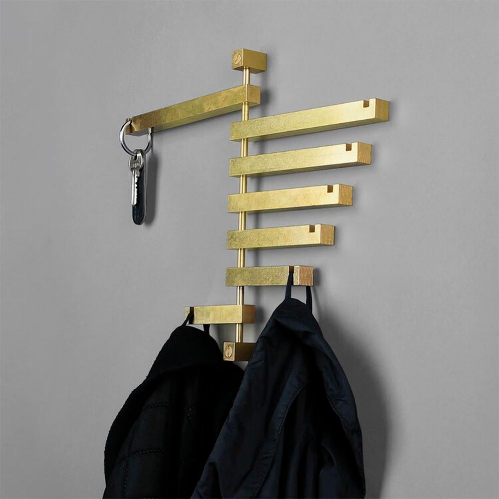 Brass seven coat rack by OxDenmarq
Dimensions: D 19 x W 18 x H 25.5 cm
Materials: Brass

OX DENMARQ is a Danish design brand aspiring to make beautiful handmade furniture, accessories and lighting in natural high-quality materials in fair