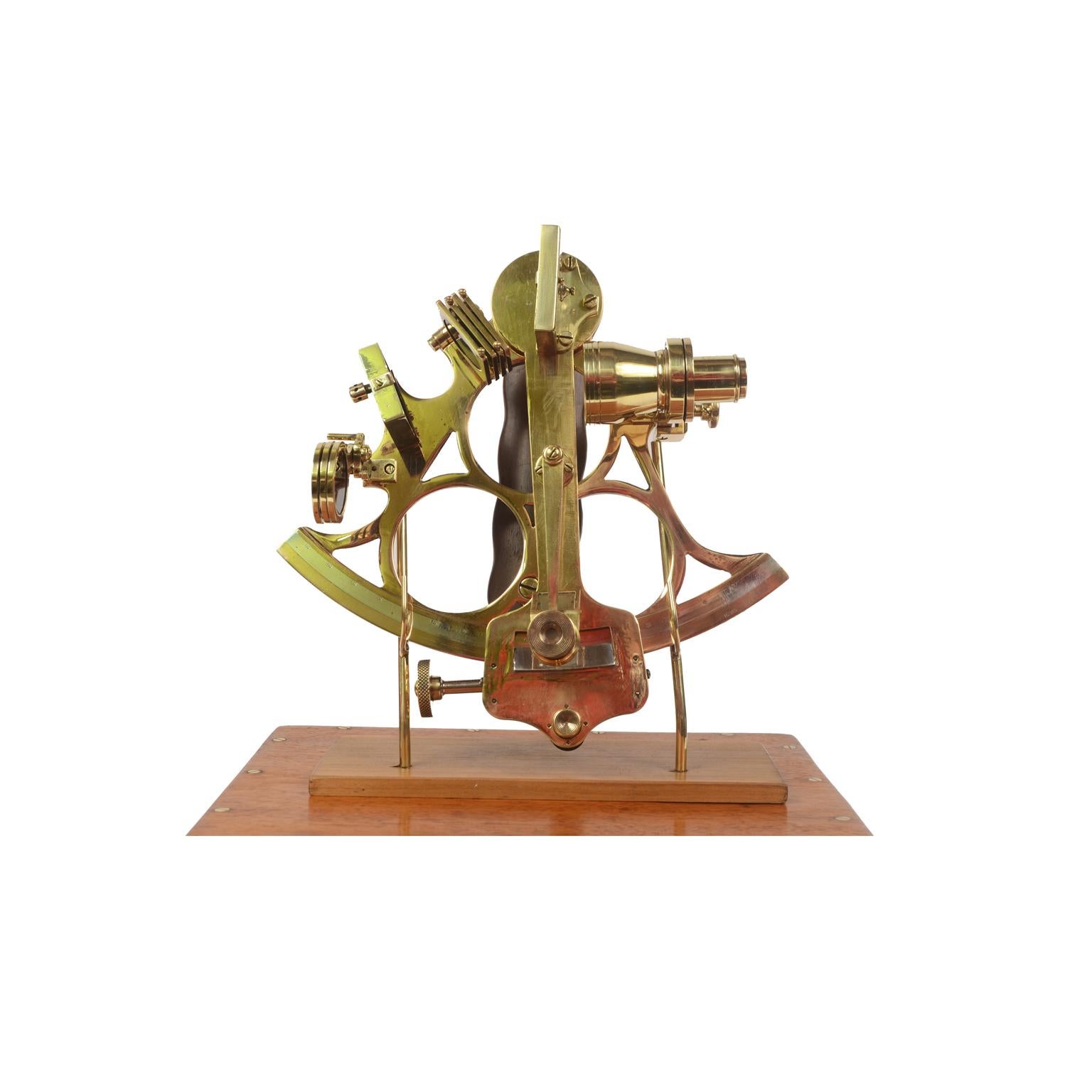 Brass sextant signed John Lilley & Son Ltd London & North Shields, made in 1913 circa, in its original mahogany box with brass handles, hinges and locking hooks. Brass frame with engraved silver goniometric scale embedded in the arch, with scale