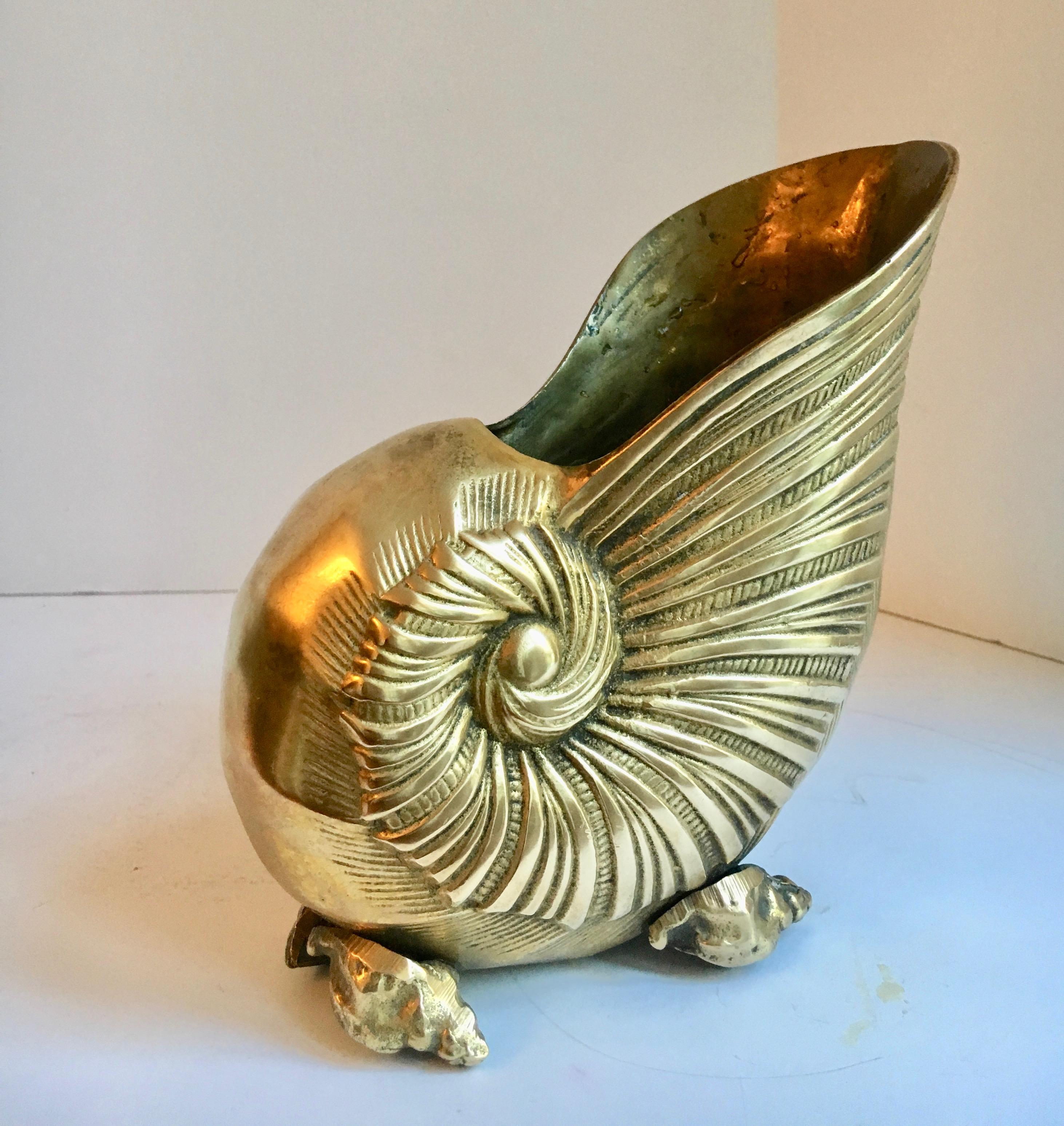 Brass shell cachepot planter - a very handsome shell nautical planter perfect for the desk and befitting of an orchid or small planting.

Beautiful brass with a very solid and dynamic presence.