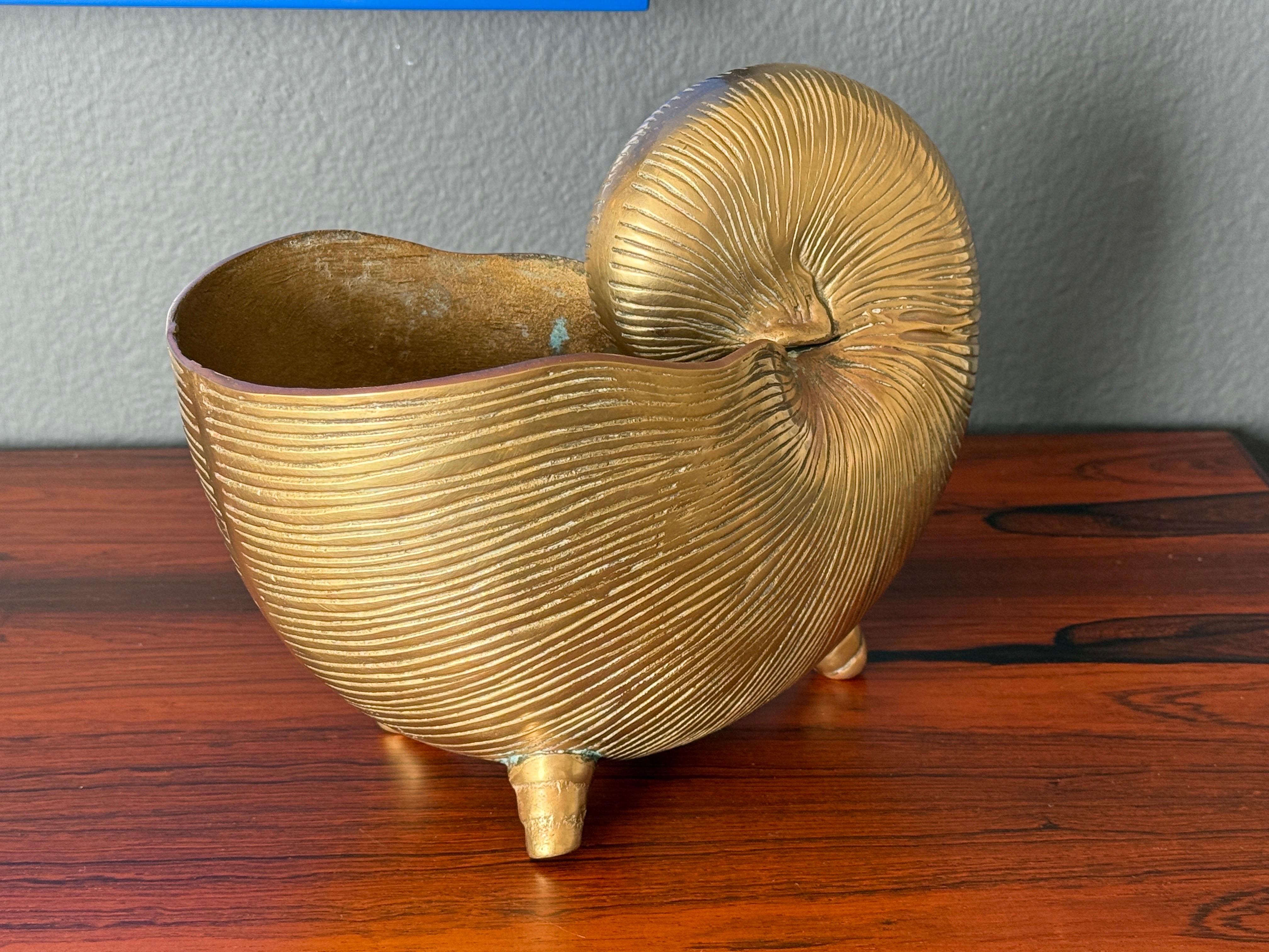 Patinated brass footed conch shell planter.