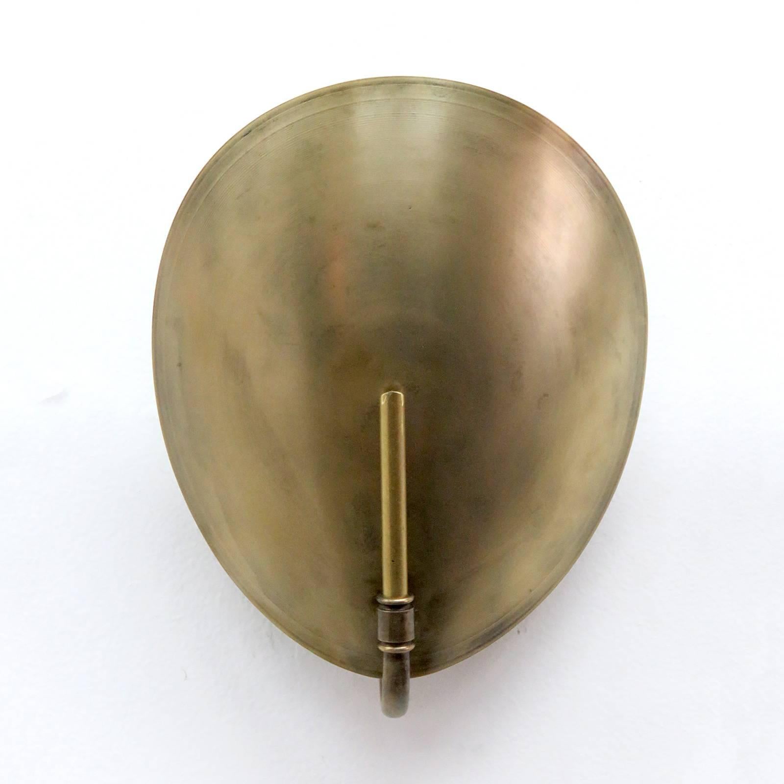 Wonderful small-scale, aged brass wall lights by Gallery L7, handcrafted and finished in Los Angeles from American brass, also available with individual on/off pull switch, one E26 socket per fixture, max. wattage 75w each  or LED equivalent, wired